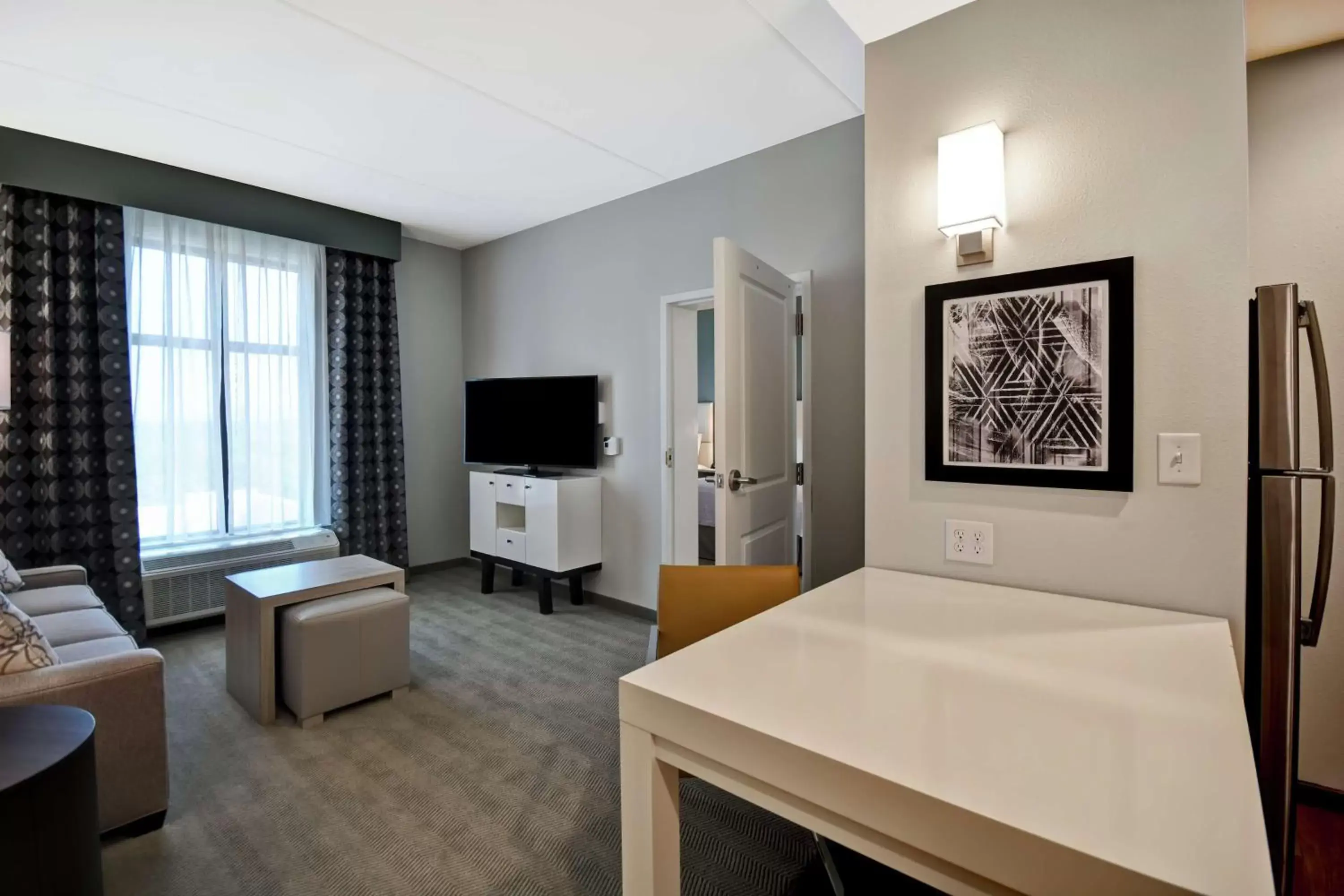 Living room, TV/Entertainment Center in Homewood Suites By Hilton Greenville Downtown