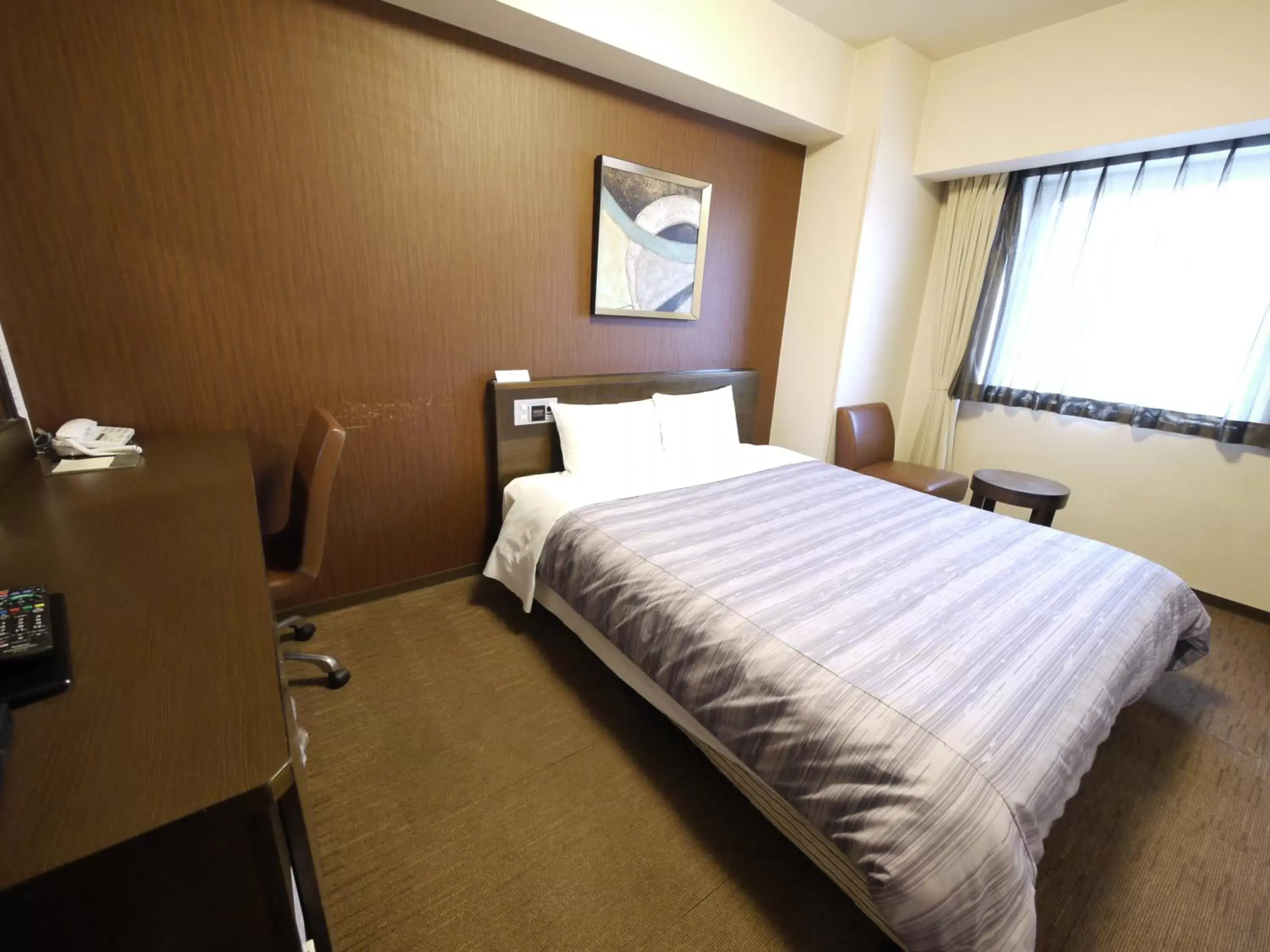 Bed in Hotel Route-Inn Chitose Ekimae