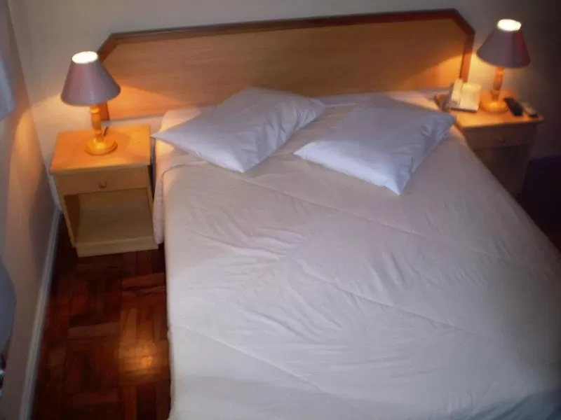 Bed in Hotel Gravataí Center