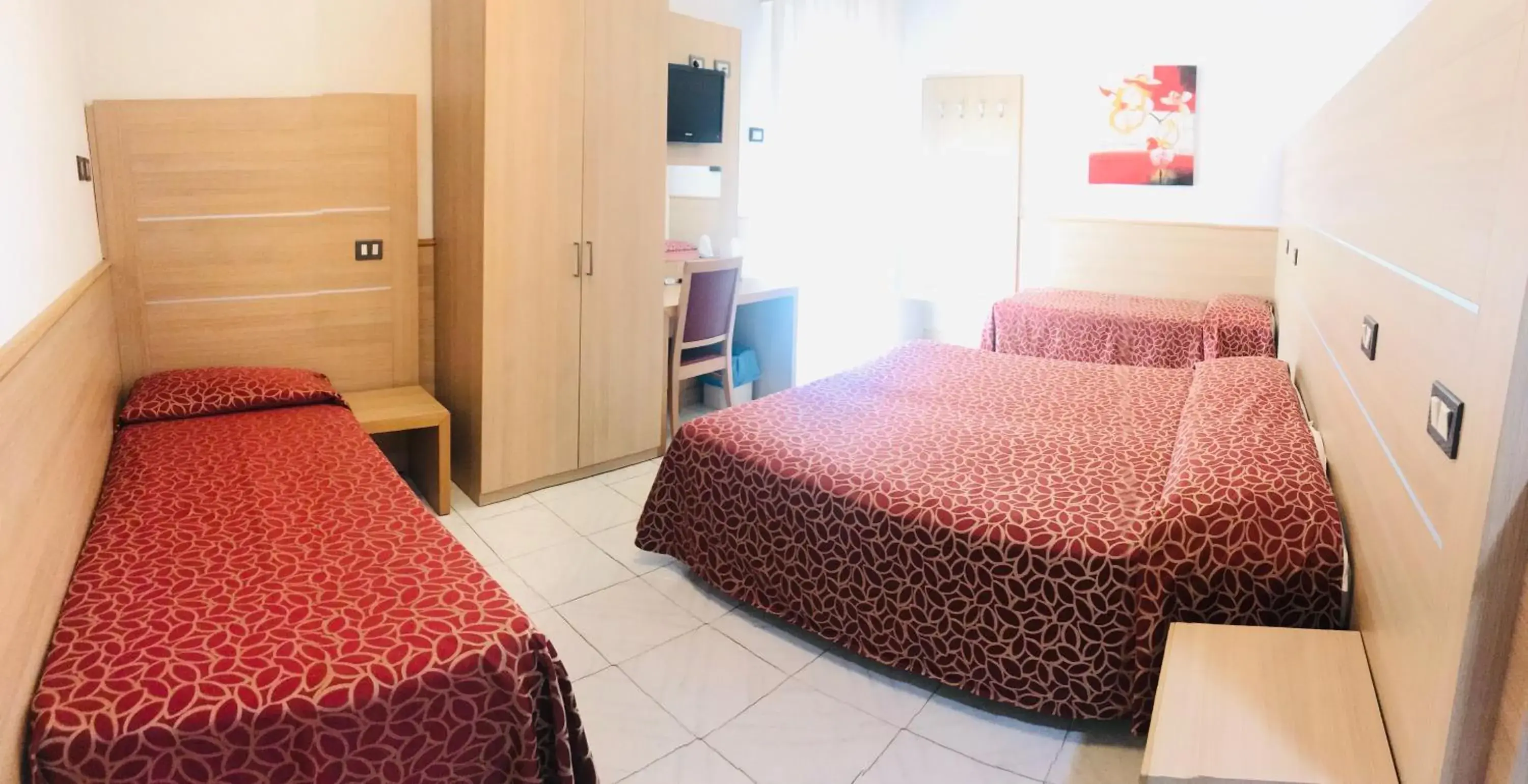 Quadruple Room in Hotel San Carlo Quadruple Room in Hotel San Carlo