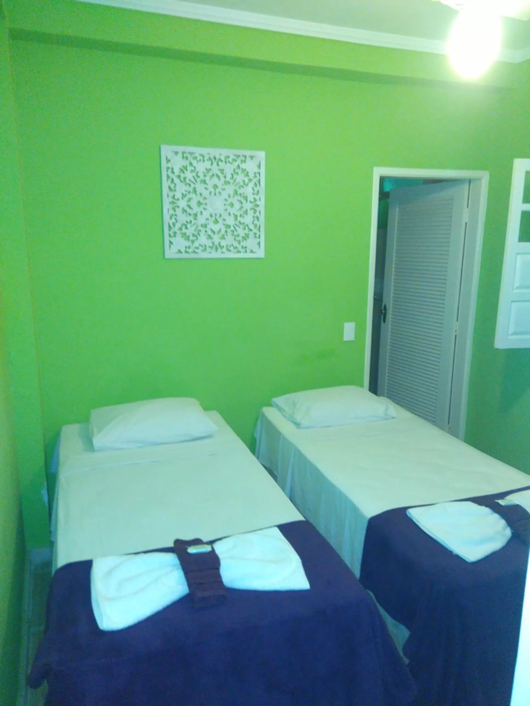 Bed in Hotel Pousada Papaya Verde