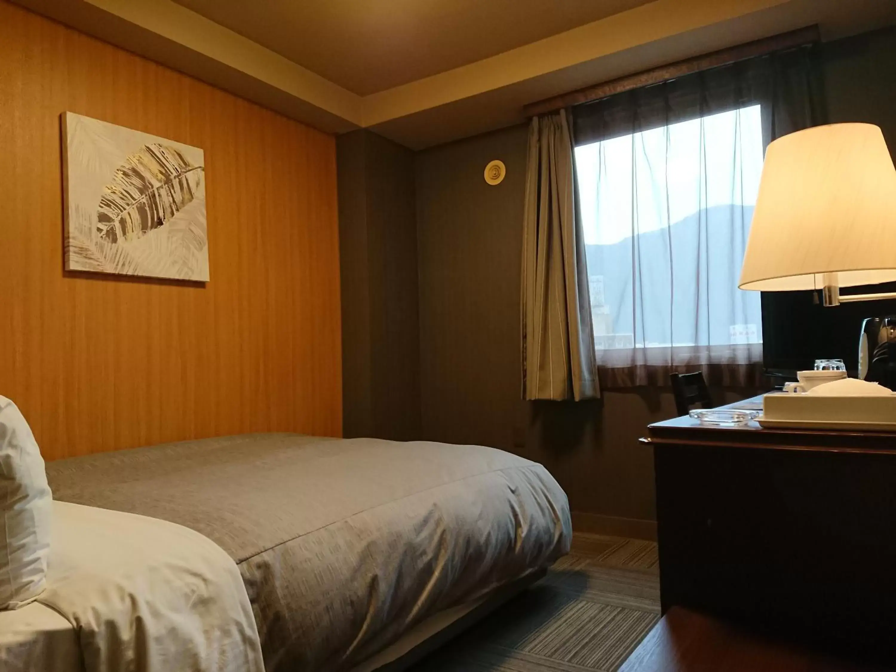 Bed in HOTEL ROUTE-INN Kamiyamada Onsen