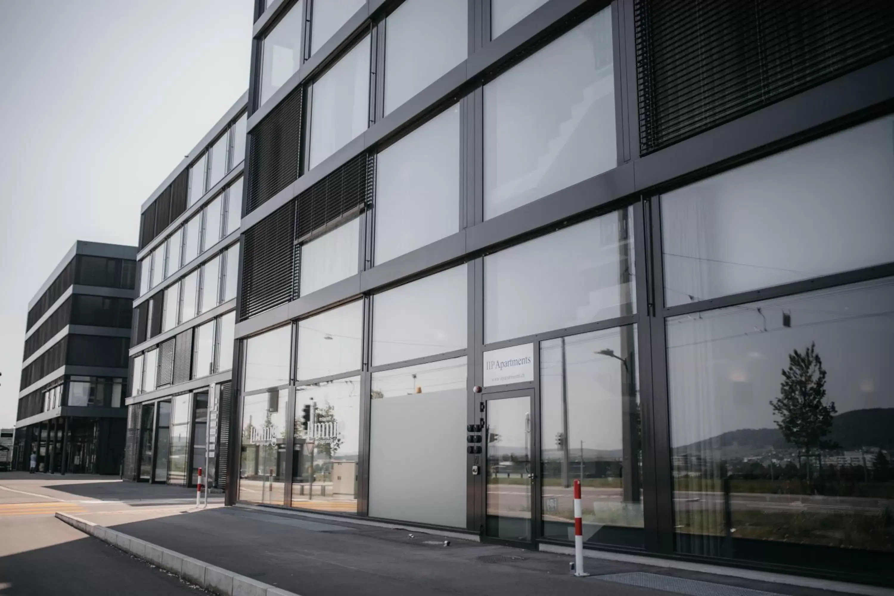 Facade/entrance, Property Building in IIP Apartments