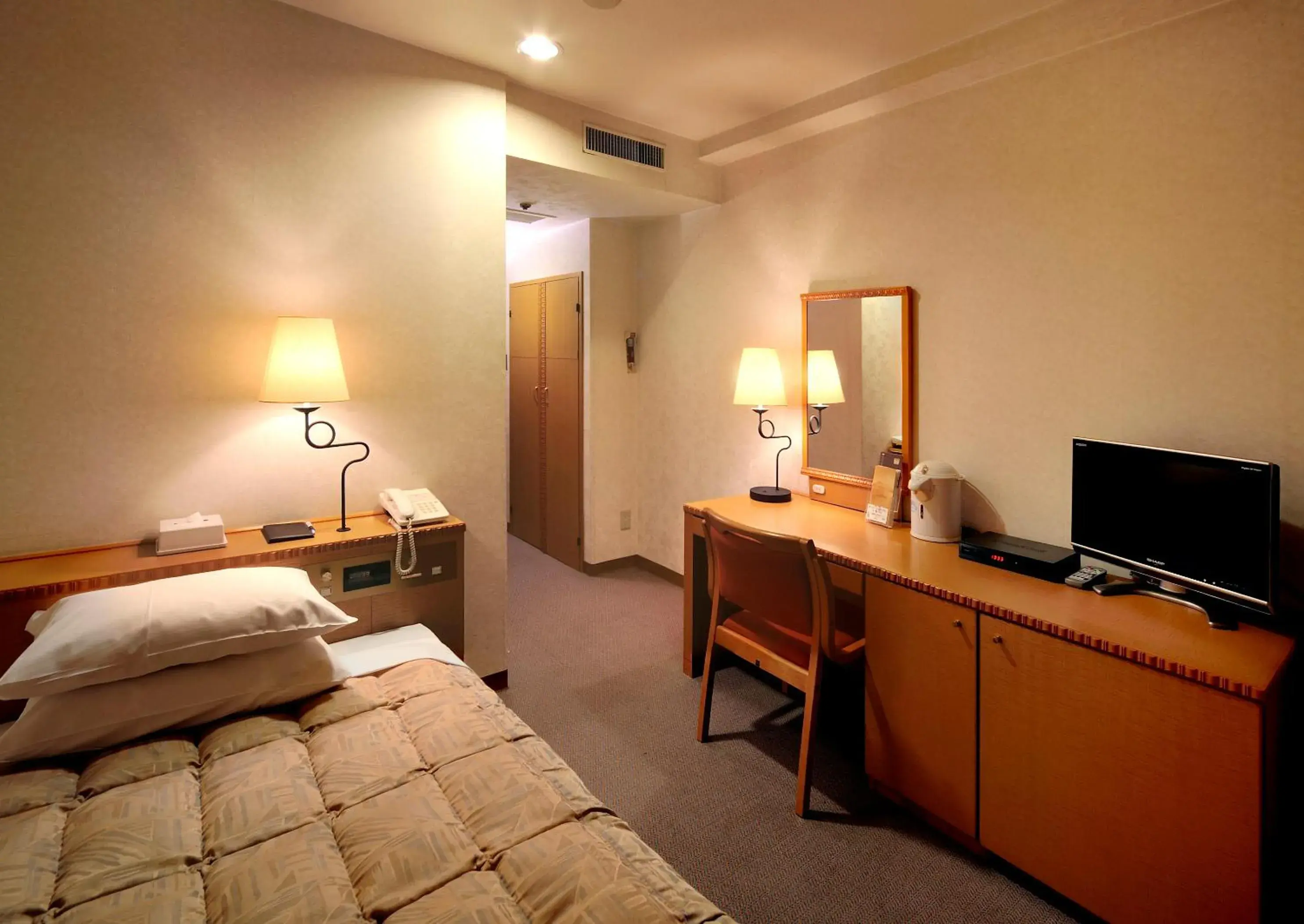 Photo of the whole room, TV/Entertainment Center in Kagoshima Sun Royal Hotel