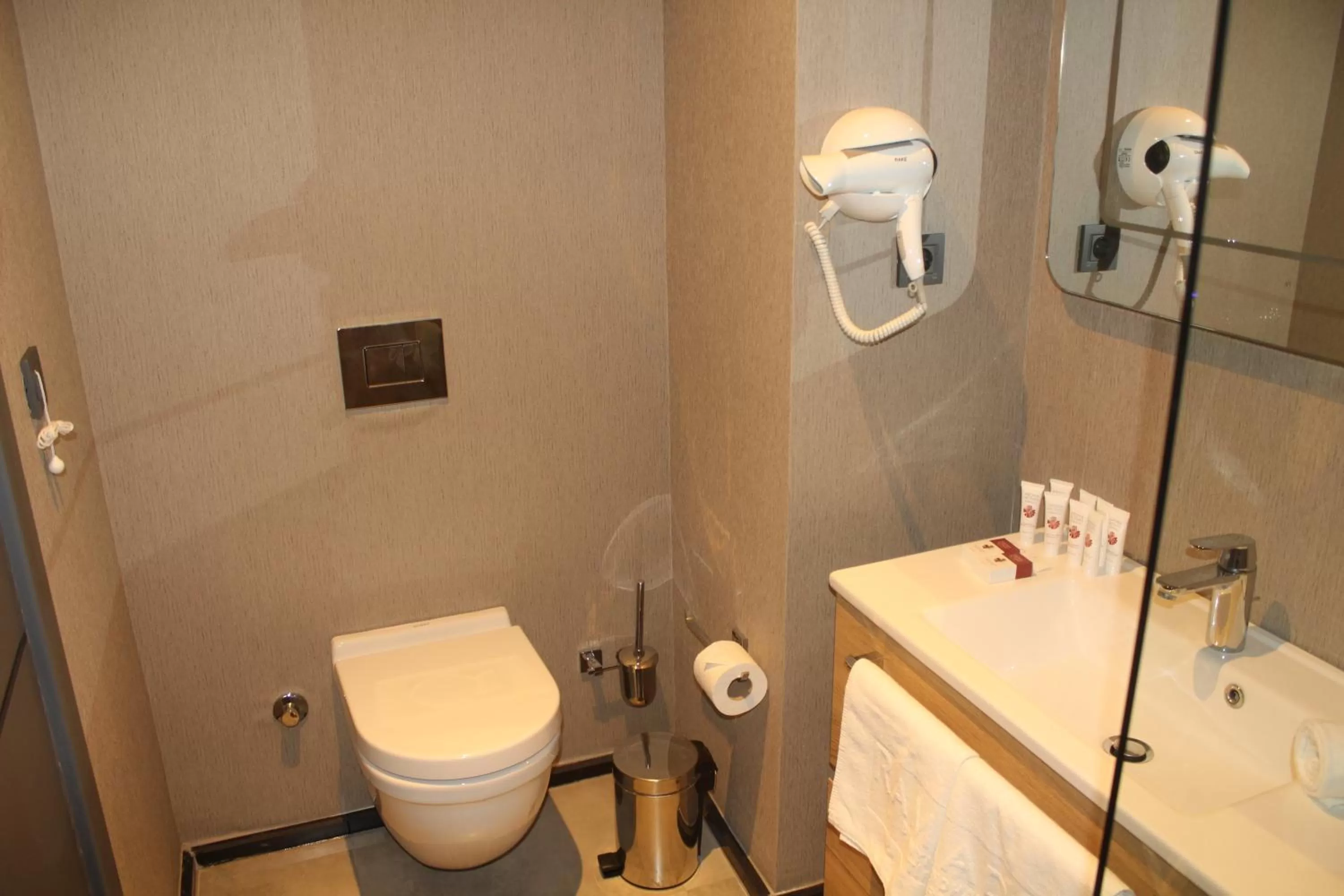 Toilet in Ramada By Wyndham Tire