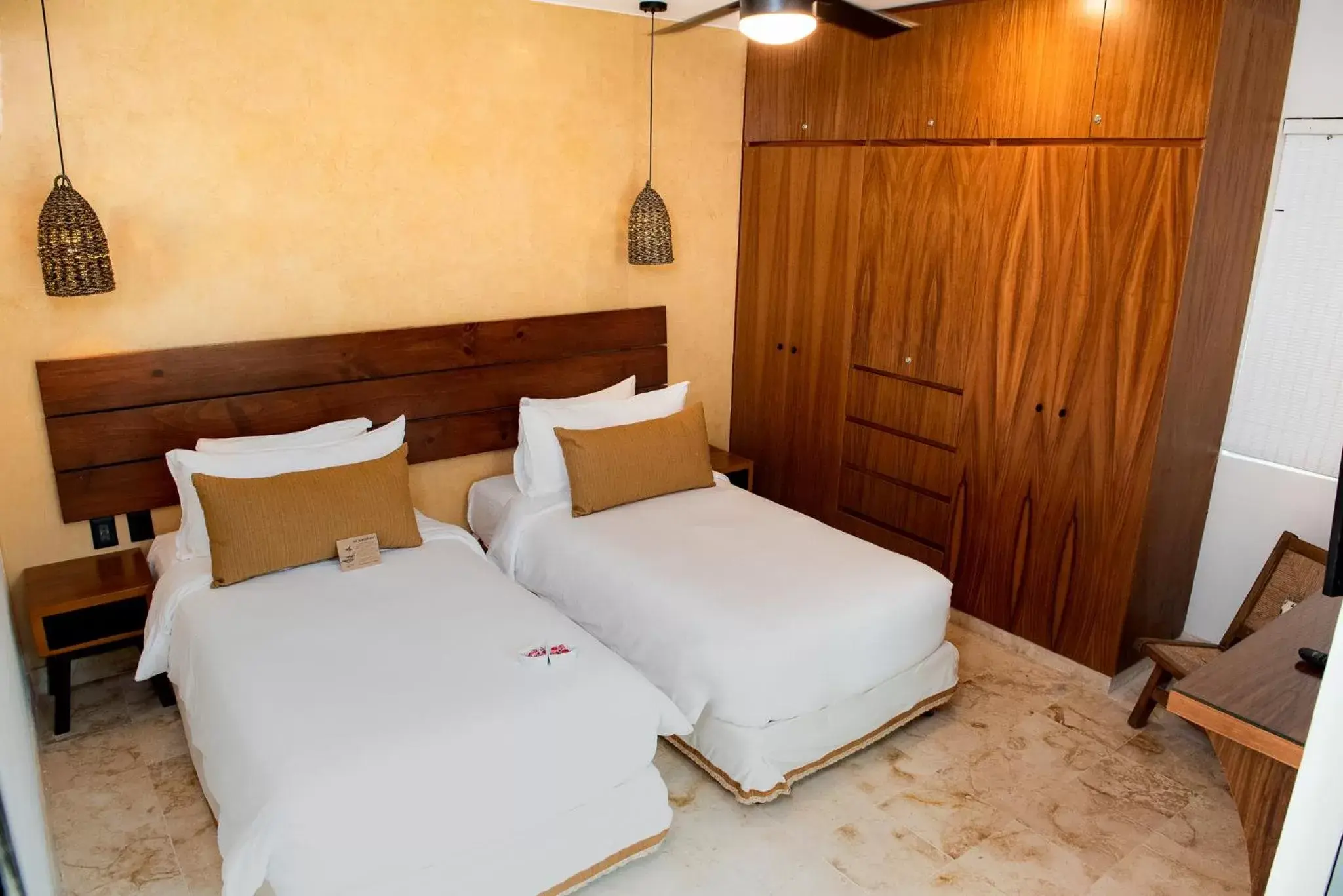 Bed in Maya Villa Condo Hotel and Beachclub
