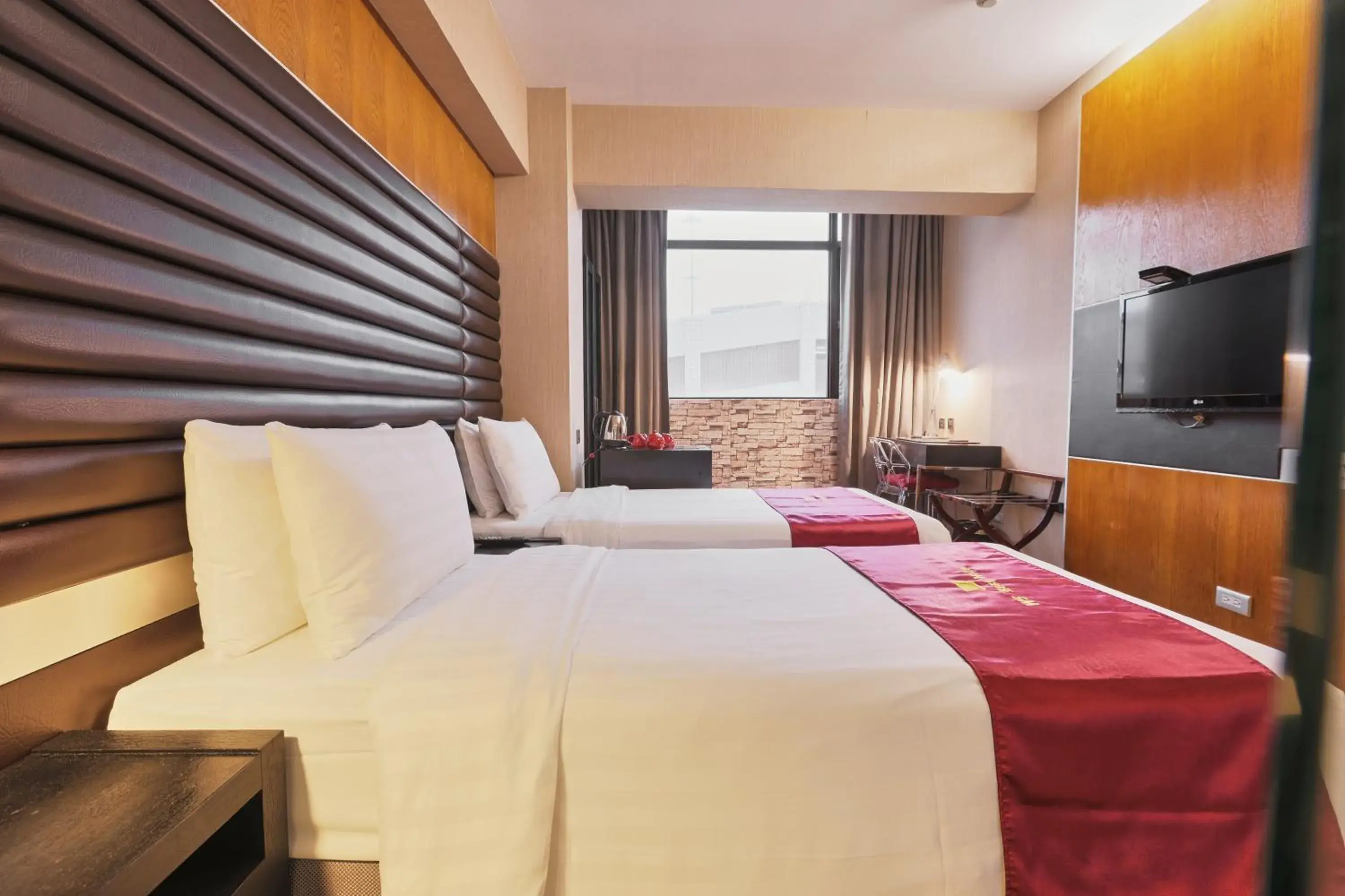 Bed in Li Duo Best Hotel