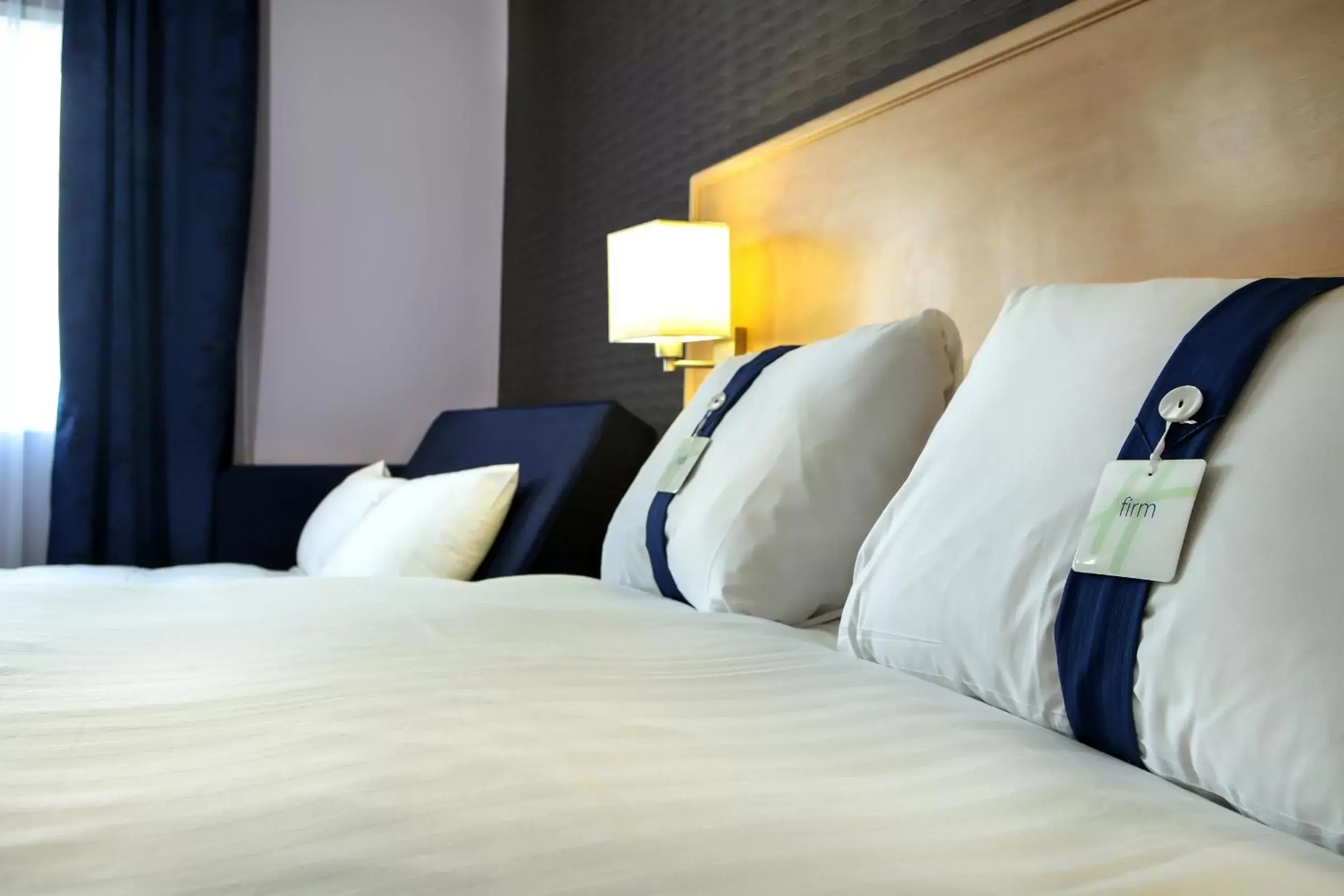 Bed in Holiday Inn Express Manchester Airport, an IHG Hotel