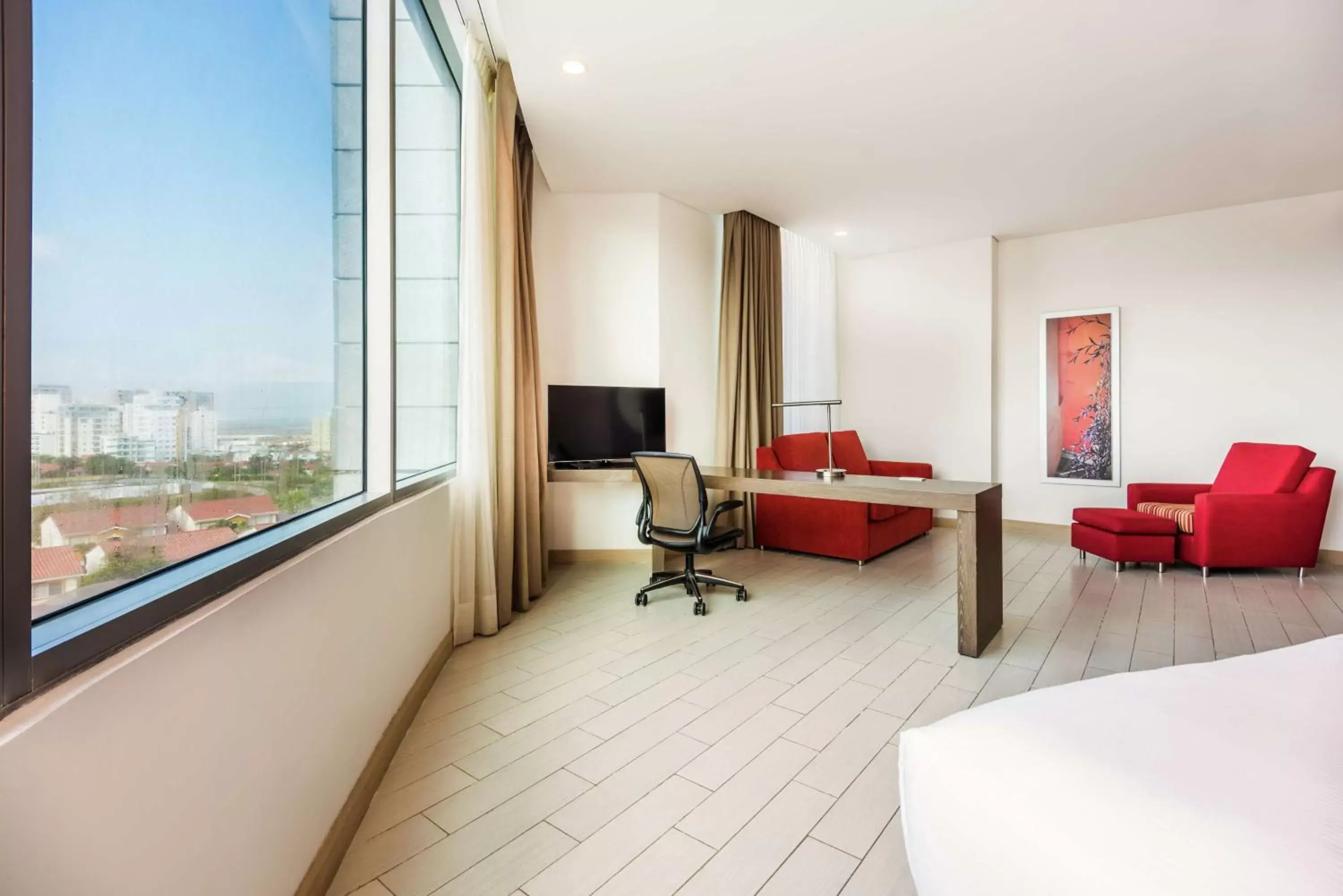 Bed, Seating Area in Hilton Garden Inn Barranquilla