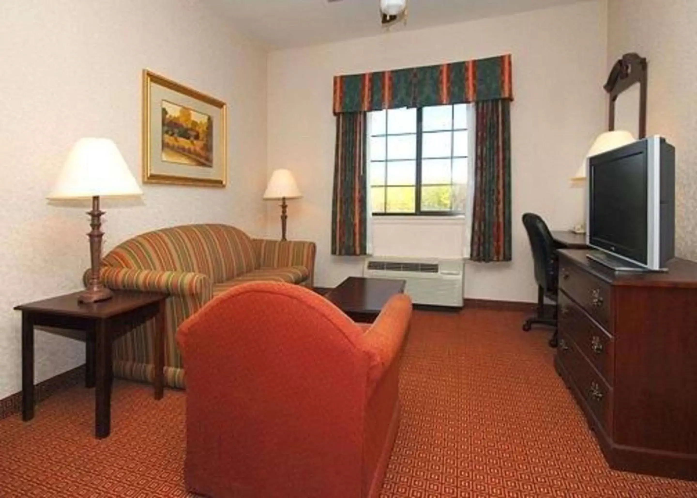 Photo of the whole room, TV/Entertainment Center in Quality Inn & Suites Near University
