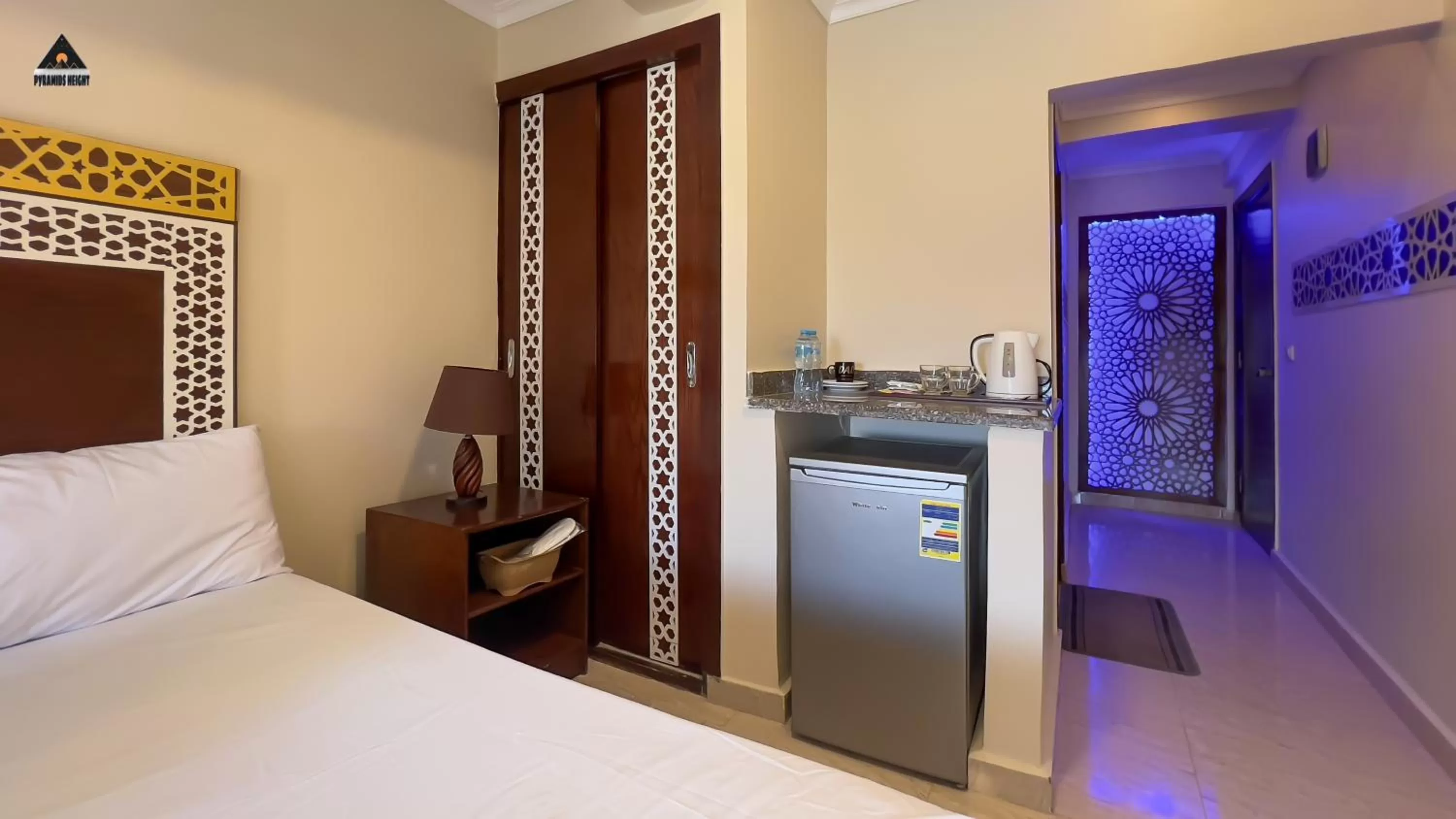 Bed in Pyramids Height Hotel & Pyramids Master Scene Rooftop