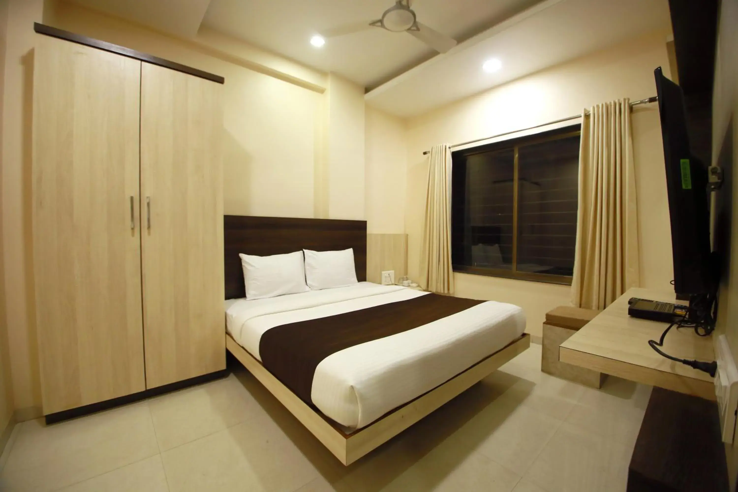 Bed, Room Photo in Hotel Madhuri Executive