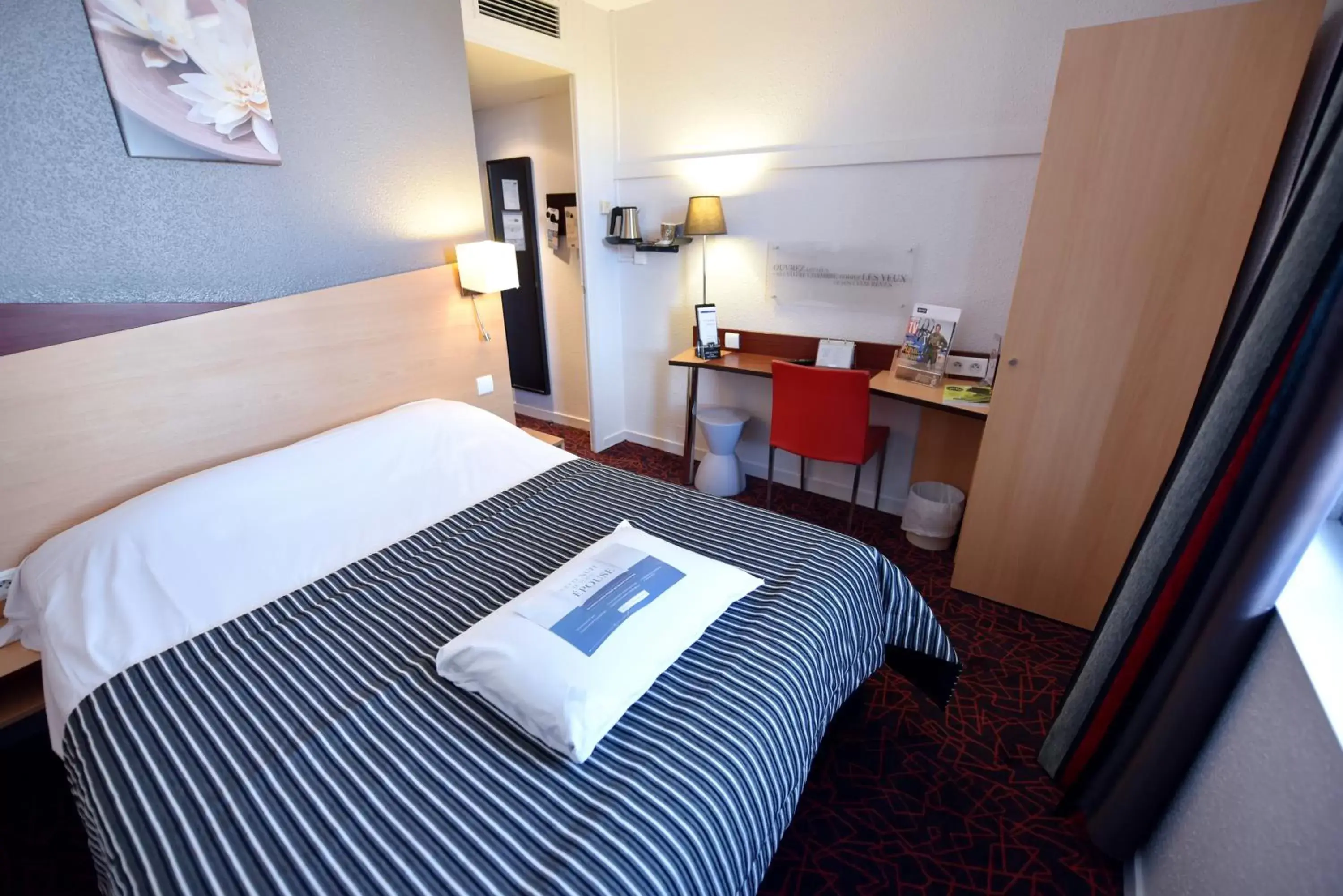 Bedroom in Kyriad Hotel Dijon Gare
