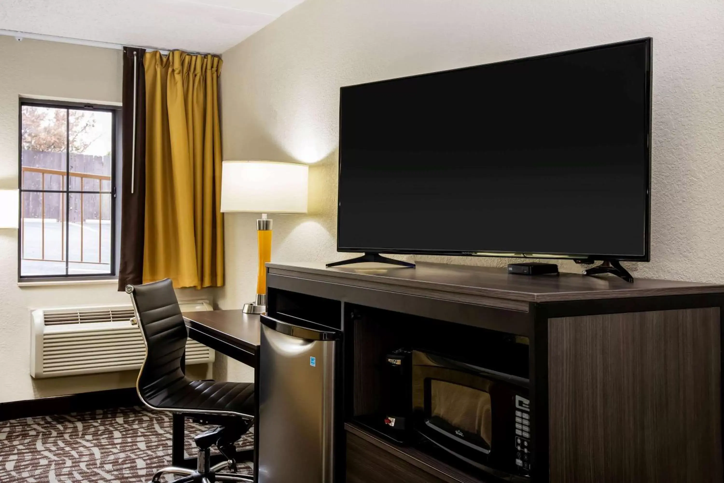 Photo of the whole room, TV/Entertainment Center in Super 8 by Wyndham Wichita East