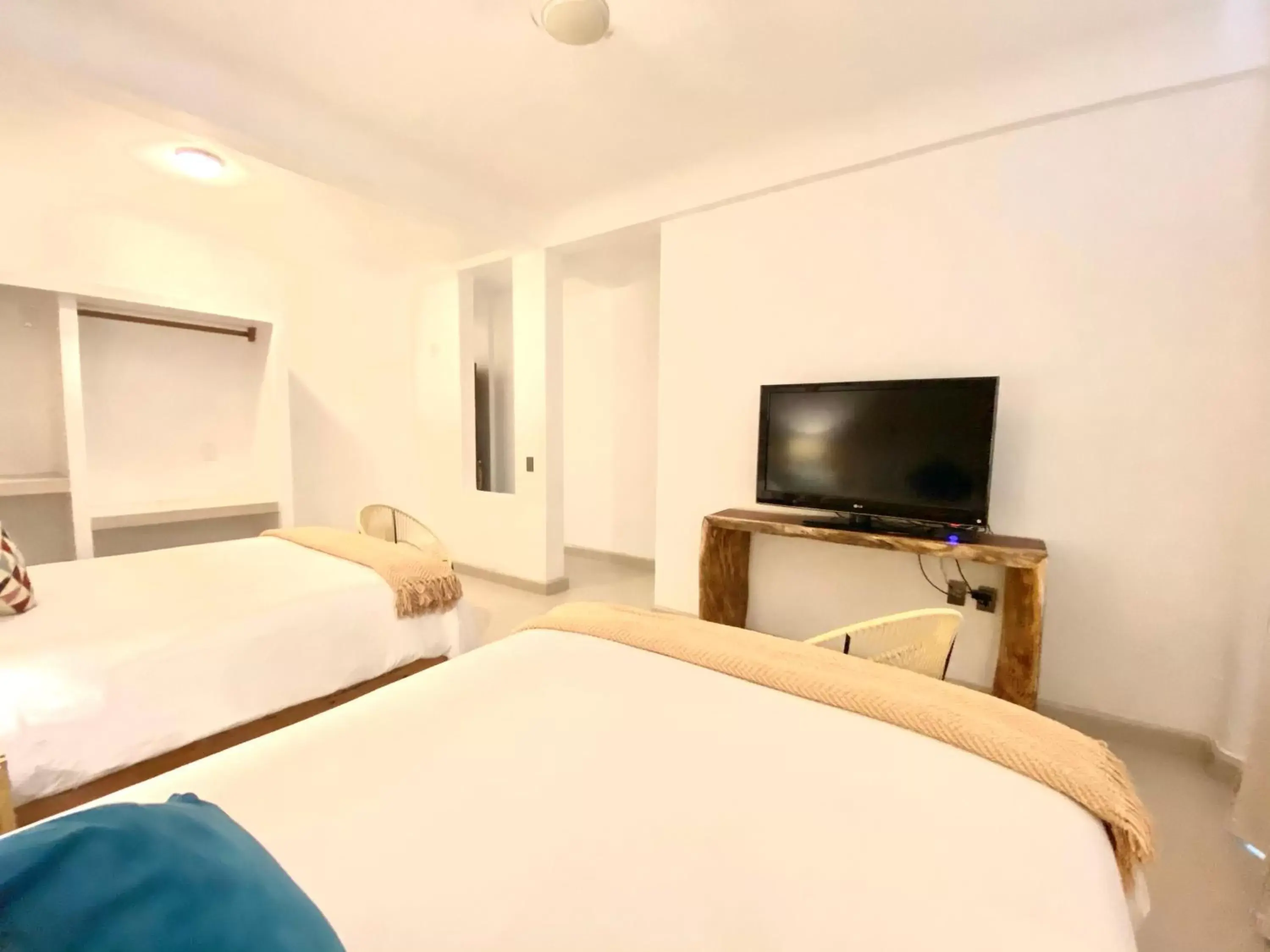 Bed, TV/Entertainment Center in Hotel Amaca Puerto Vallarta - Adults Only