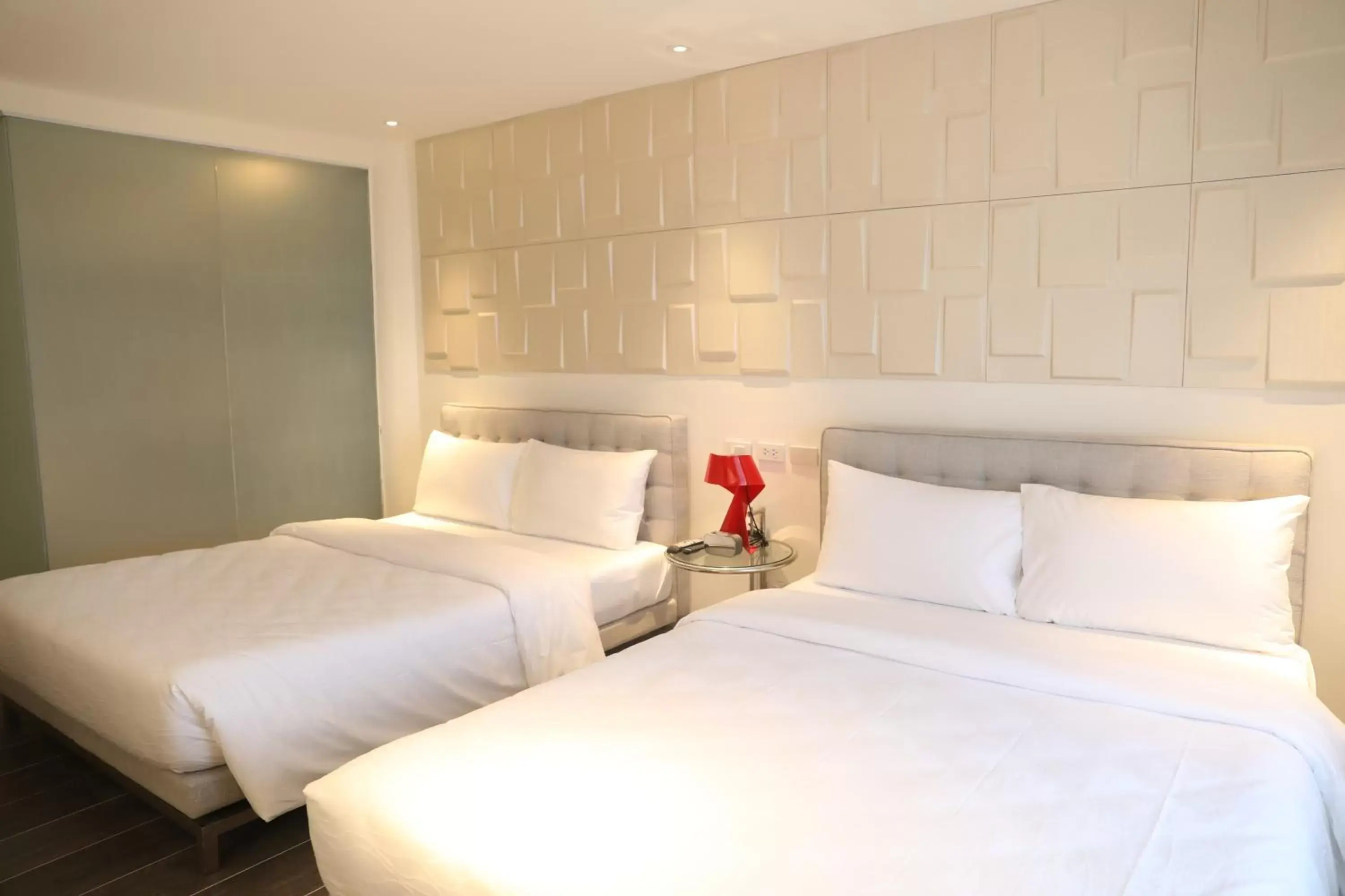 Bed in City Park Hotel Residences