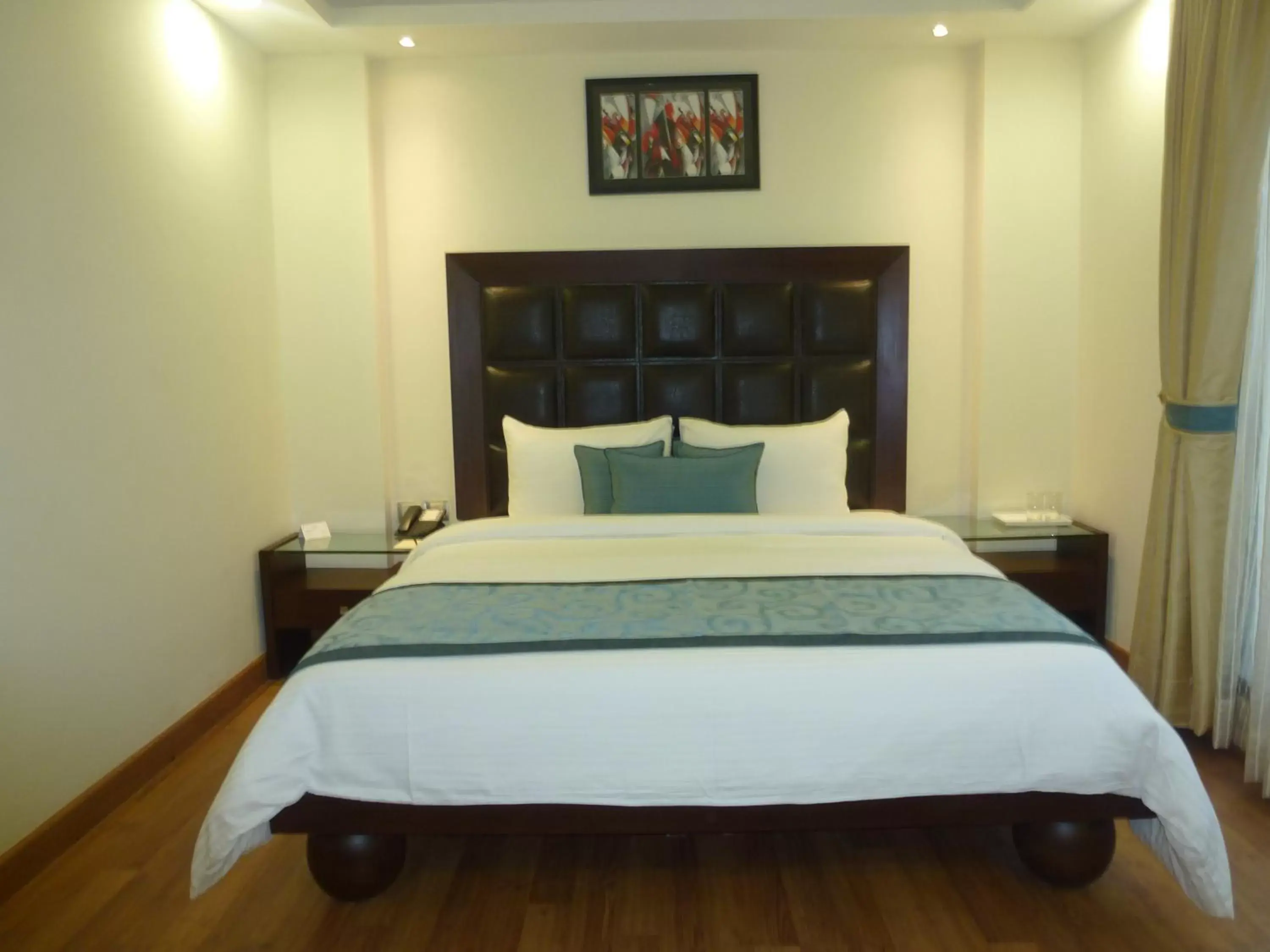 Bed in The Grand Orion - Kailash Colony