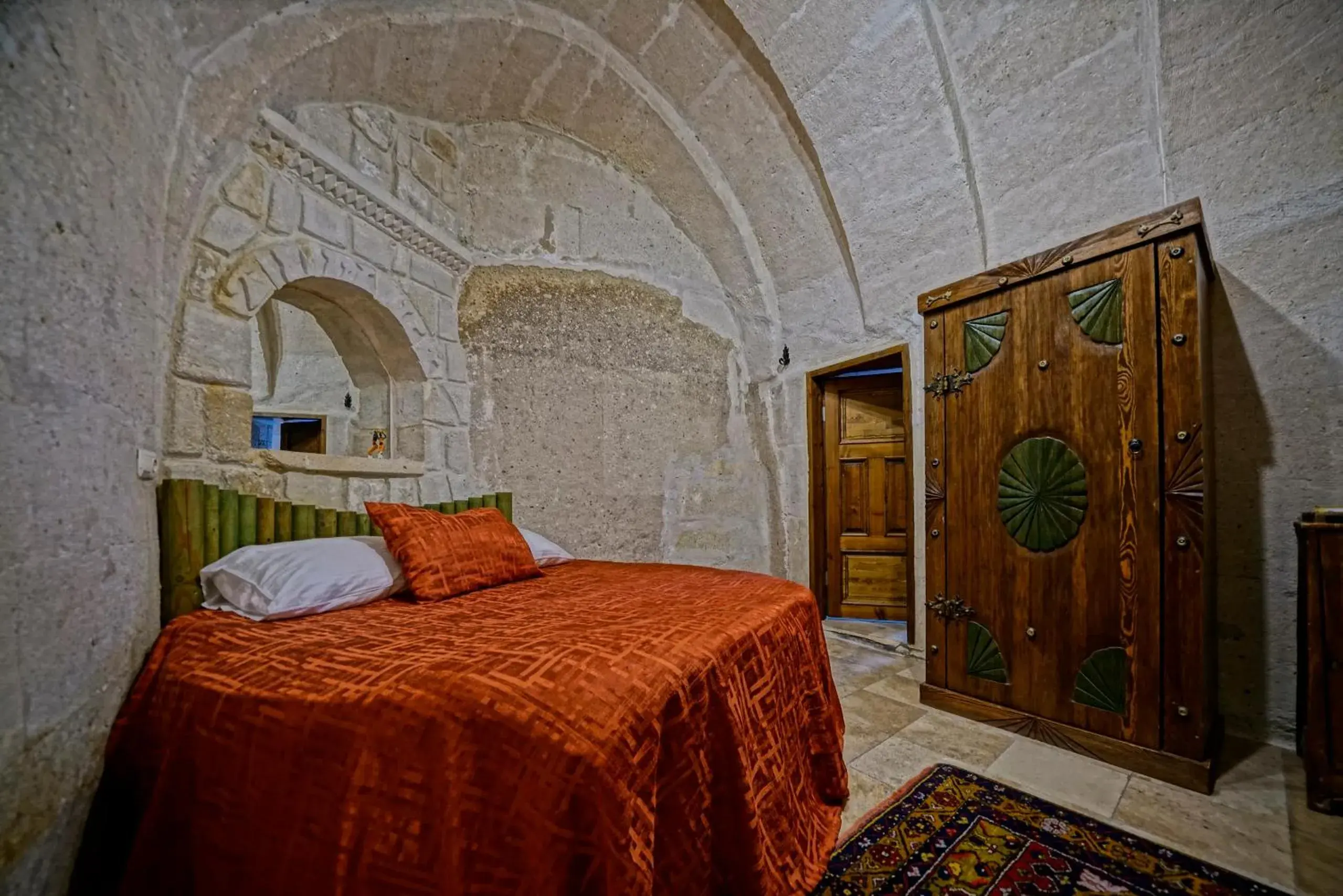 Bed in Holiday Cave Hotel