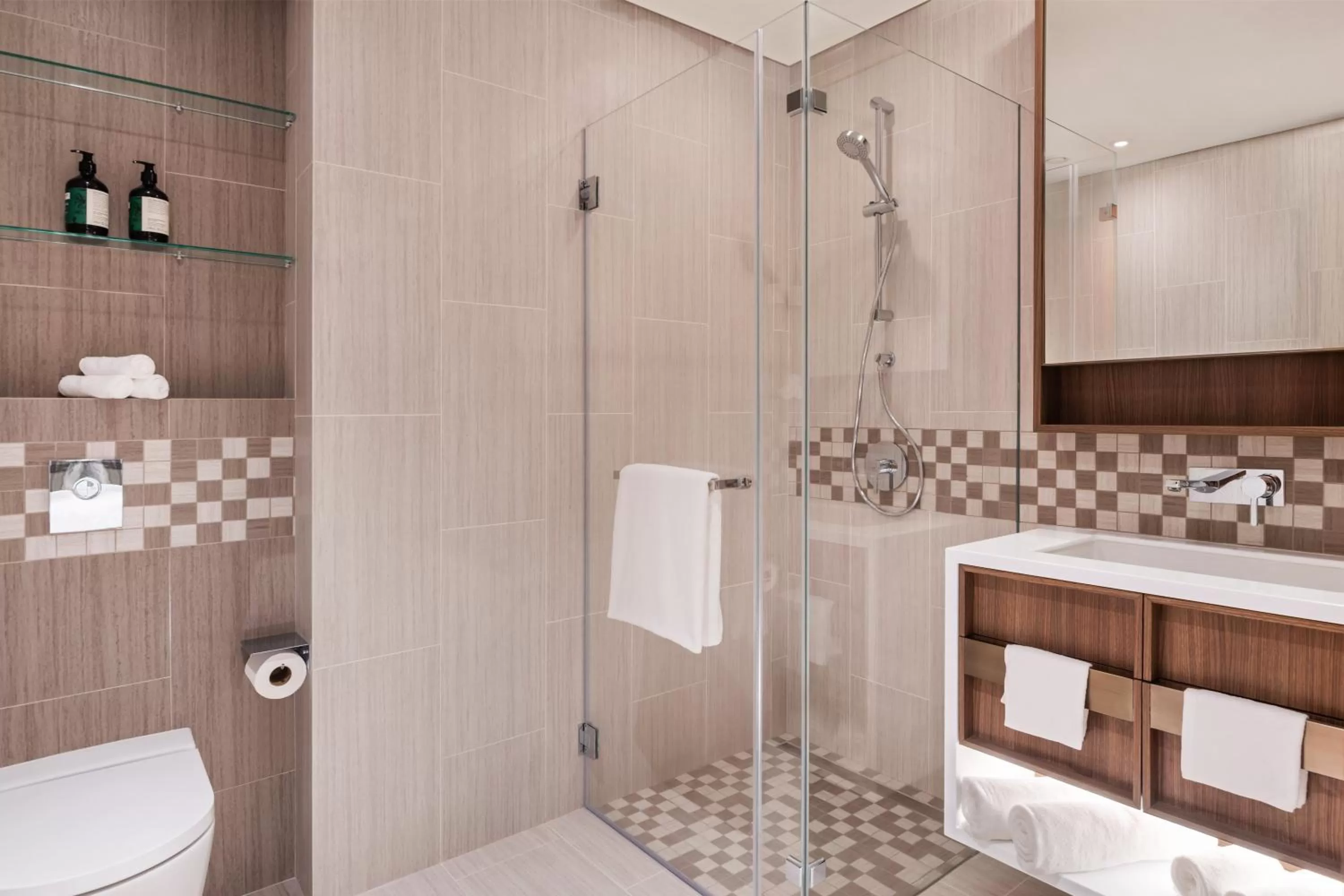 Bathroom in Staybridge Suites Dubai Al-Maktoum Airport by IHG