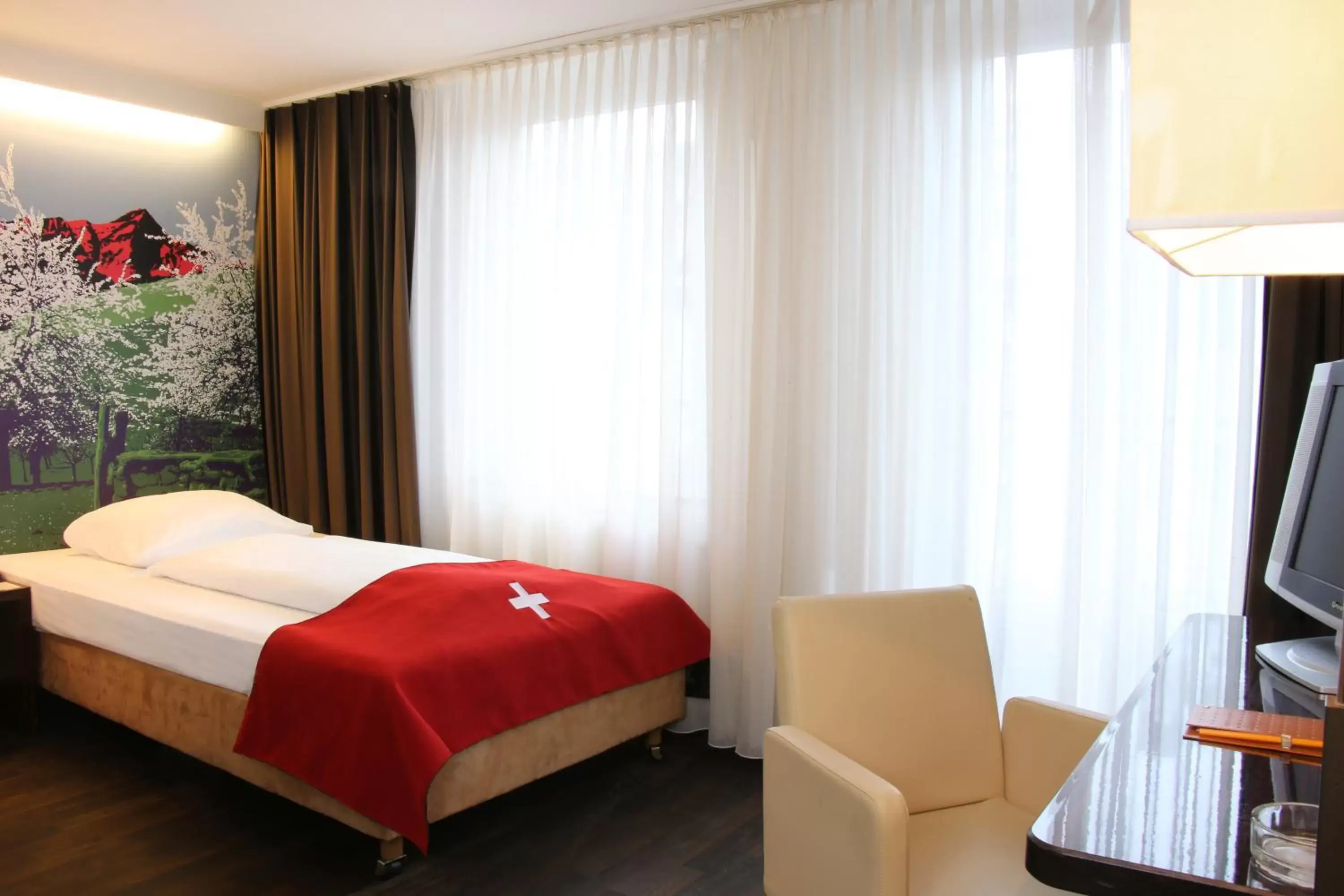 Bedroom, Bed in Helvetia Hotel Munich City Center