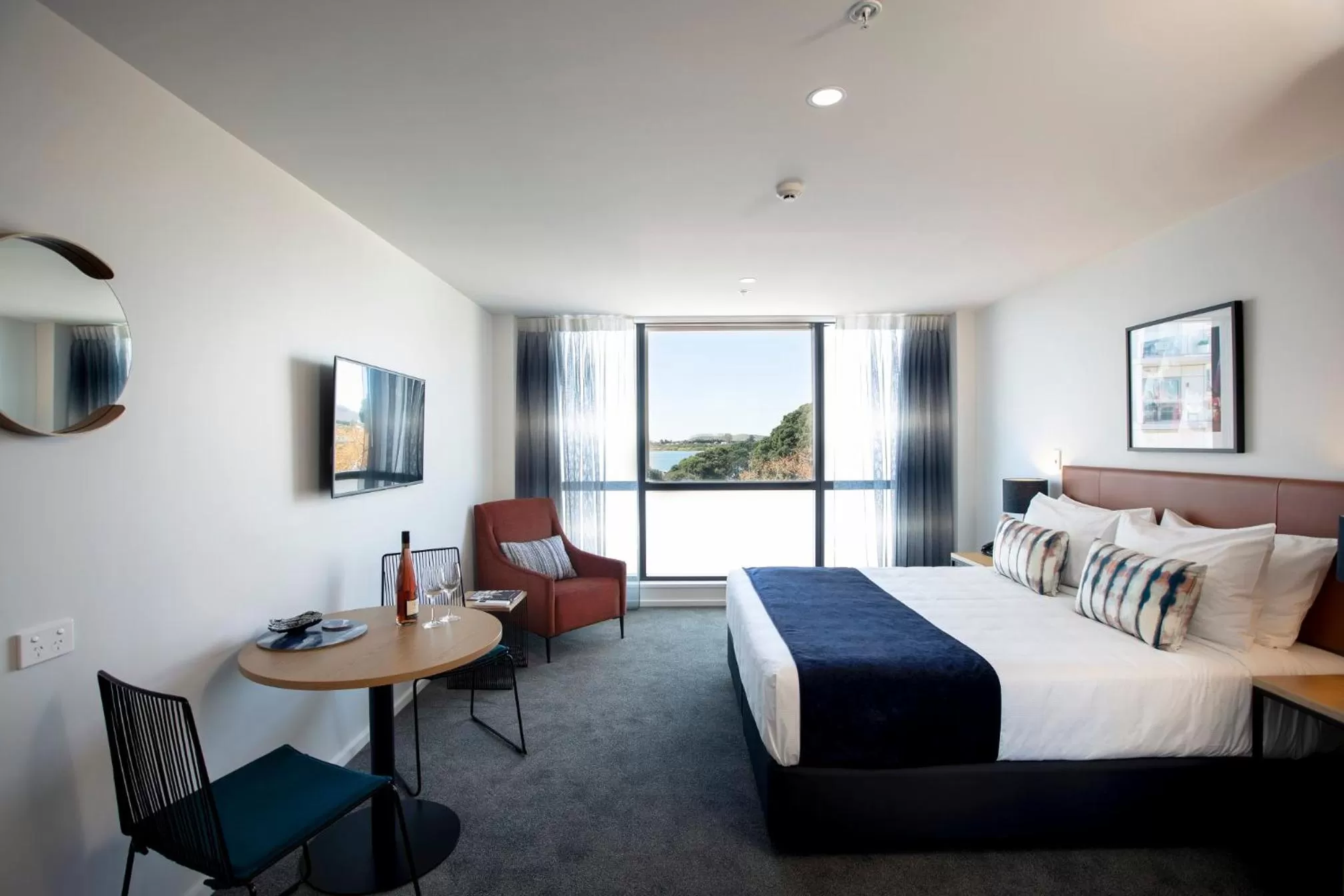Dining area, Bed in Quest Tauranga Central
