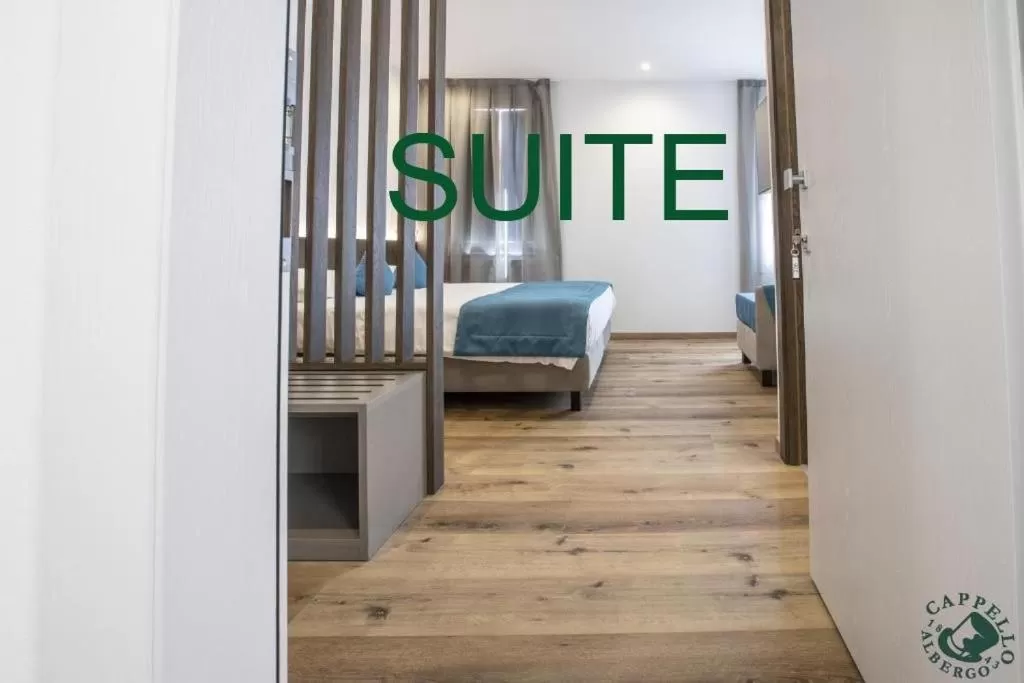 Bed in Albergo Cappello e Cadore