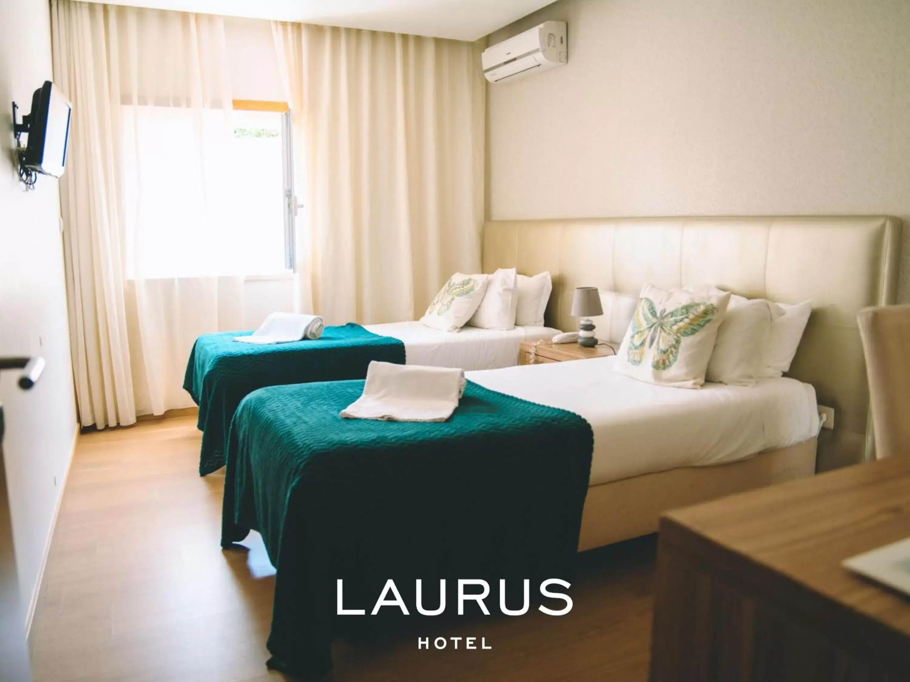 Bed in Laurus Hotel