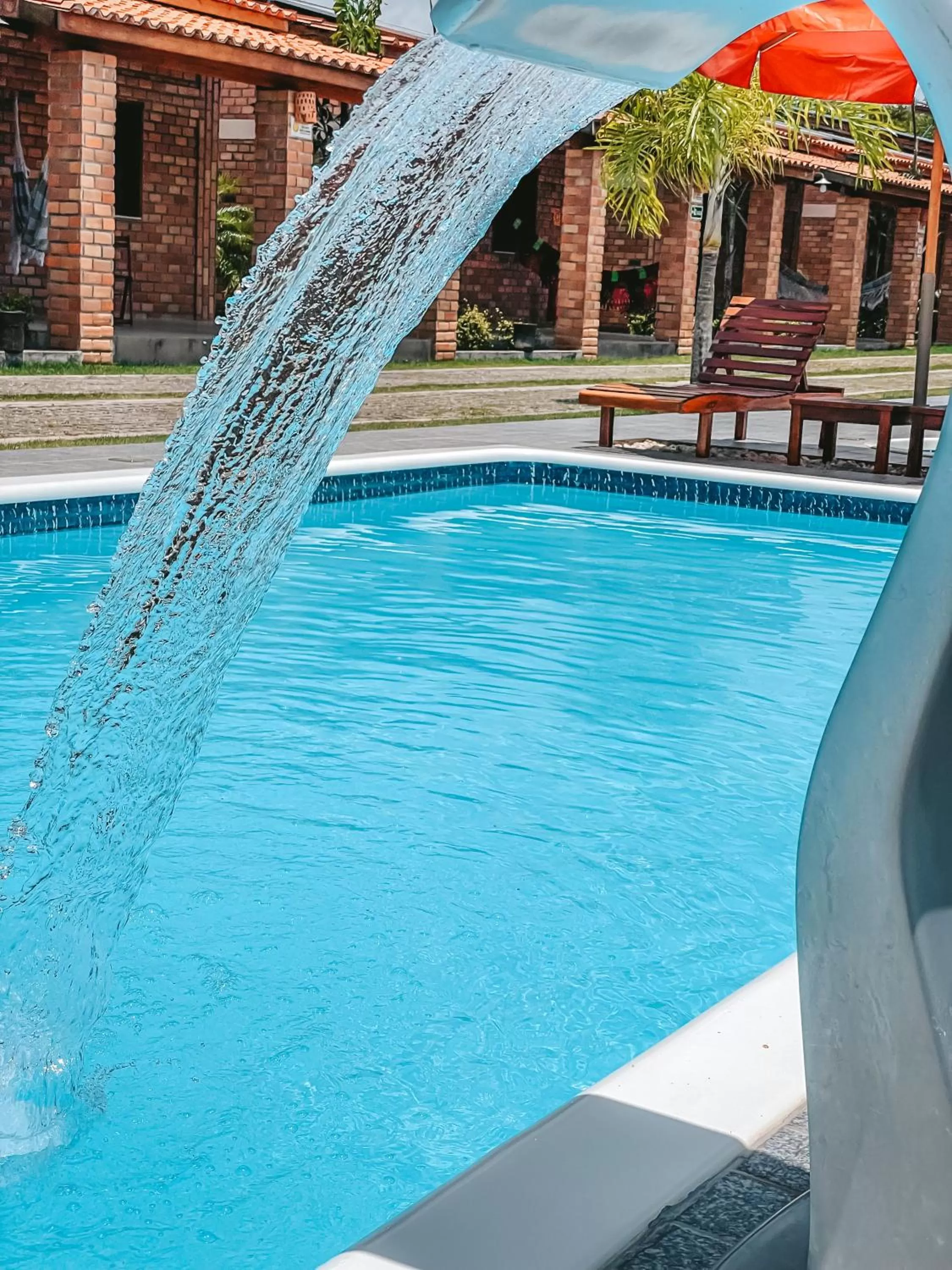 Swimming pool in Pousada Vasto Horizonte