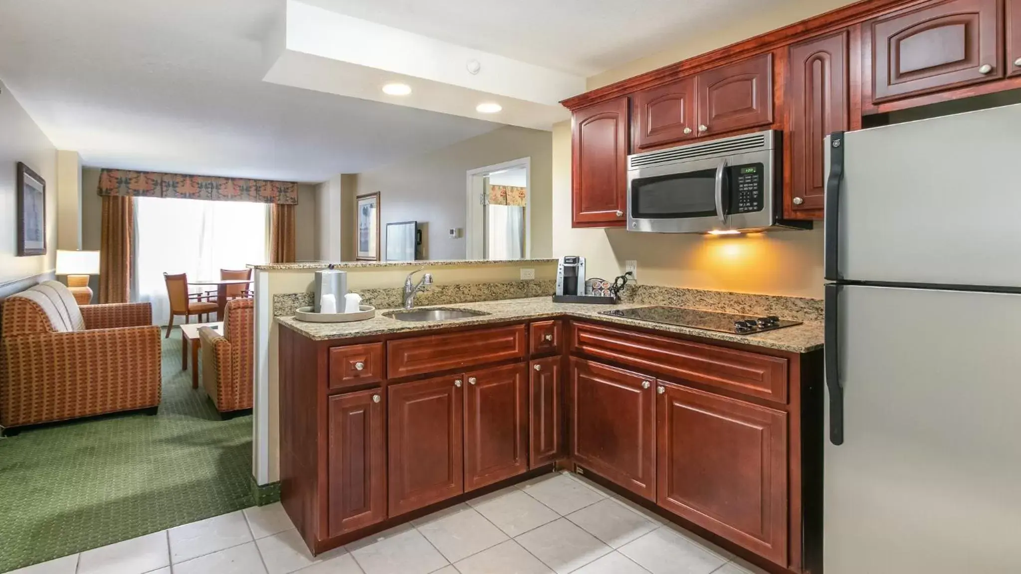 Bedroom, Kitchen/Kitchenette in Holiday Inn & Suites Clearwater Beach, an IHG Hotel