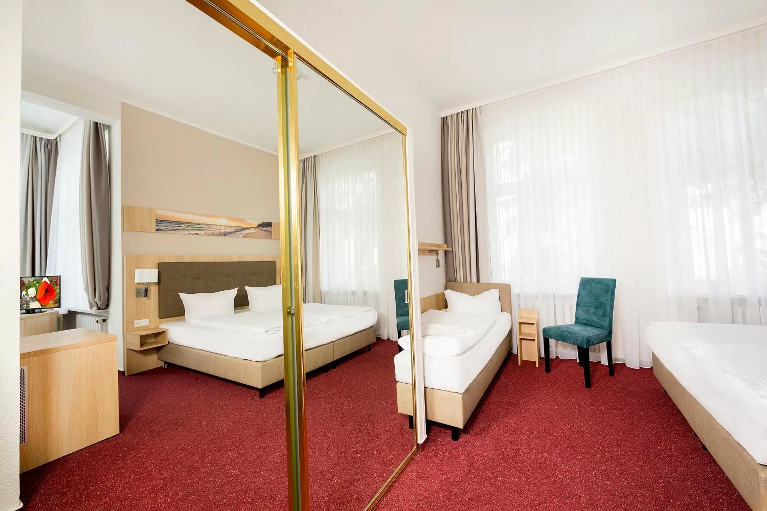 Bed in Garni Eden Hotels