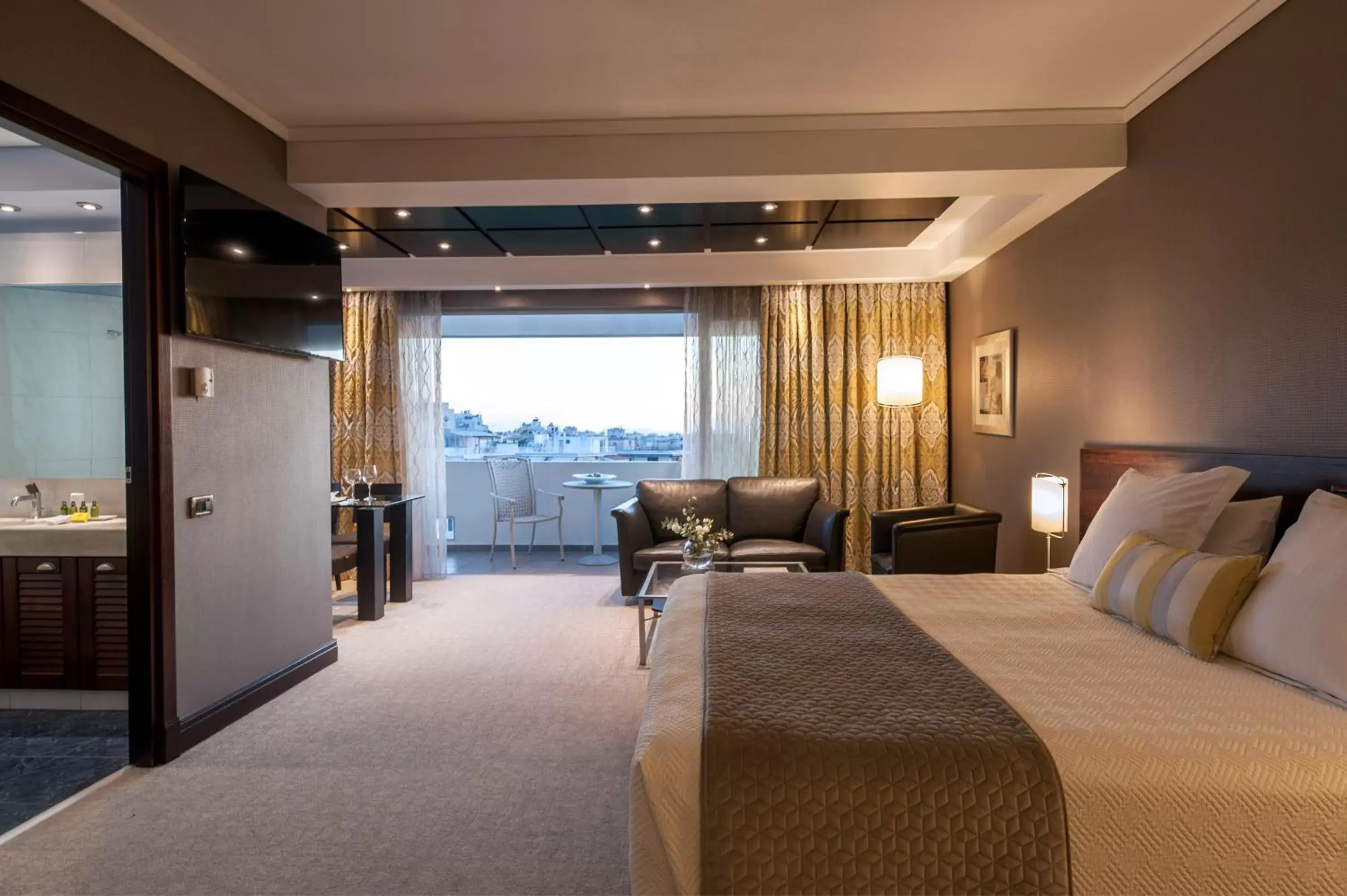 Bed in The Athenian Callirhoe Exclusive Hotel