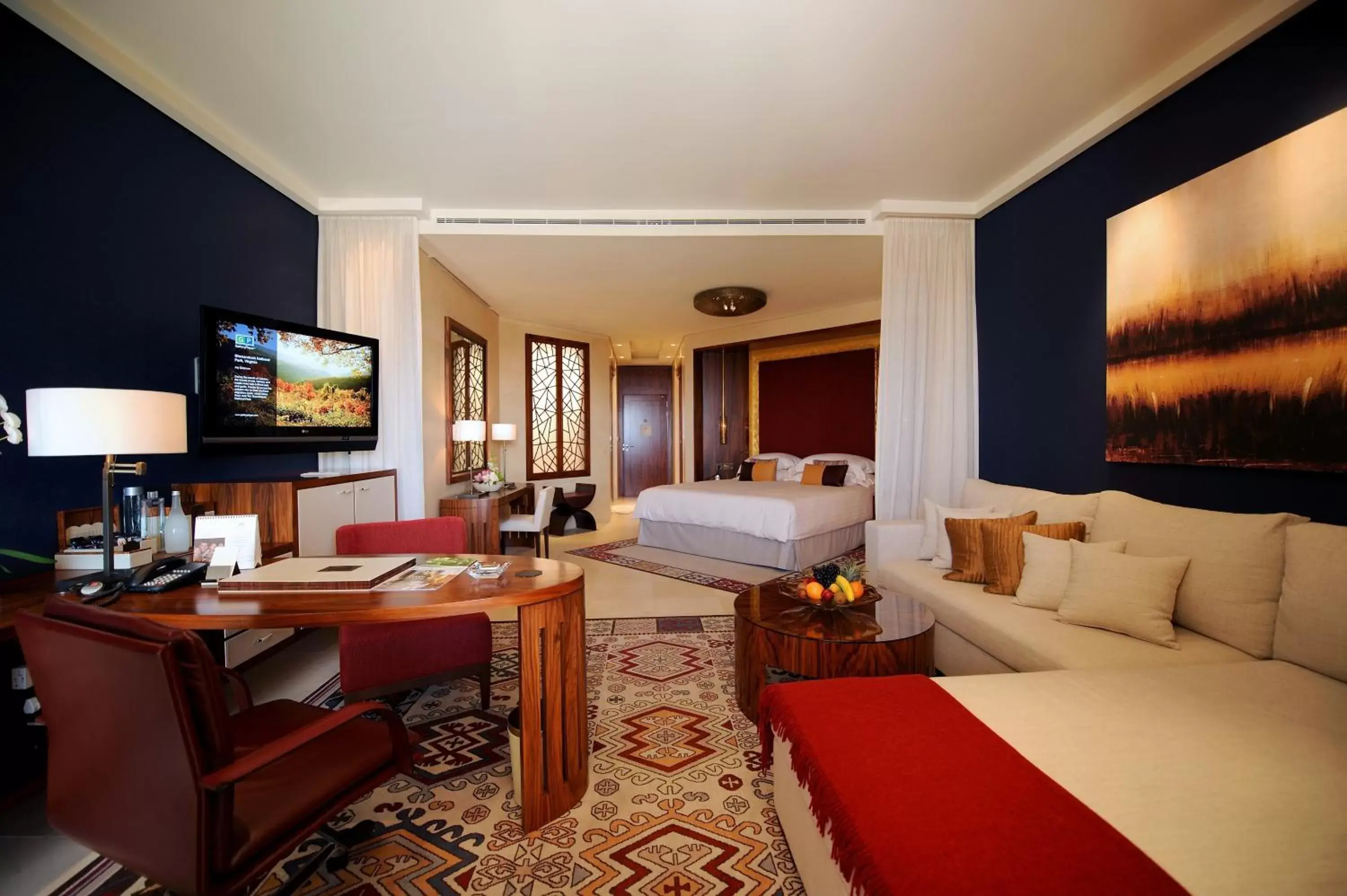 Bedroom, Seating Area in Raffles Dubai