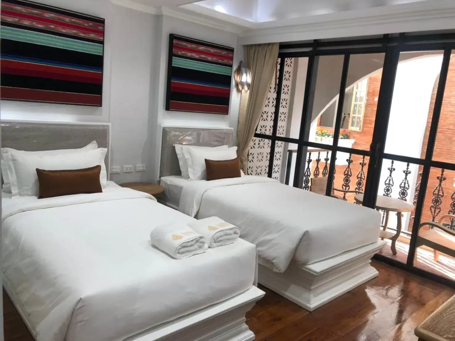 Bed in Lanna Oriental Hotel - SHA Extra Plus