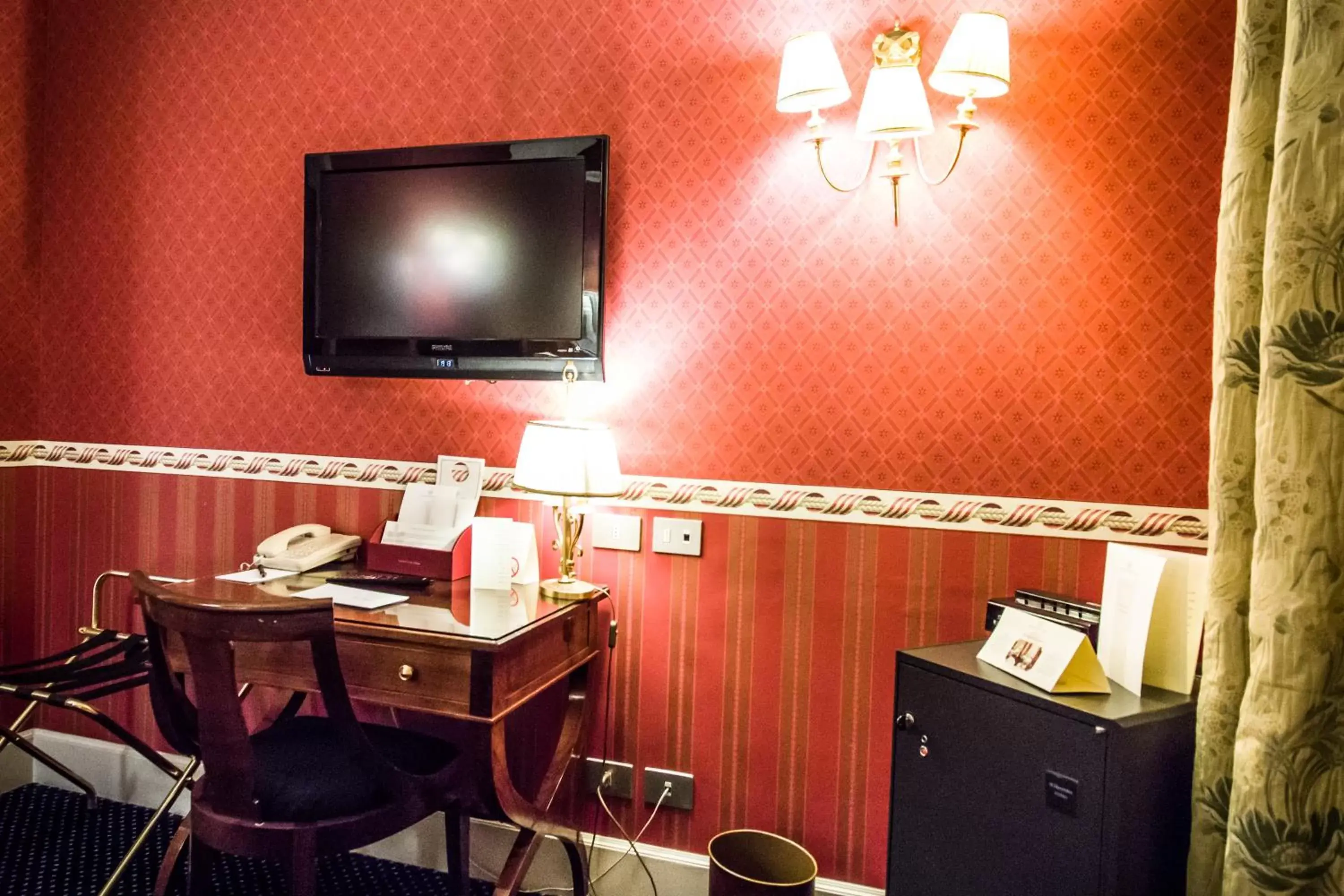 Photo of the whole room, TV/Entertainment Center in Grand Hotel Sitea