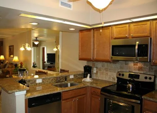 Kitchen or kitchenette in Vacation Villas 2, a Ramada by Wyndham