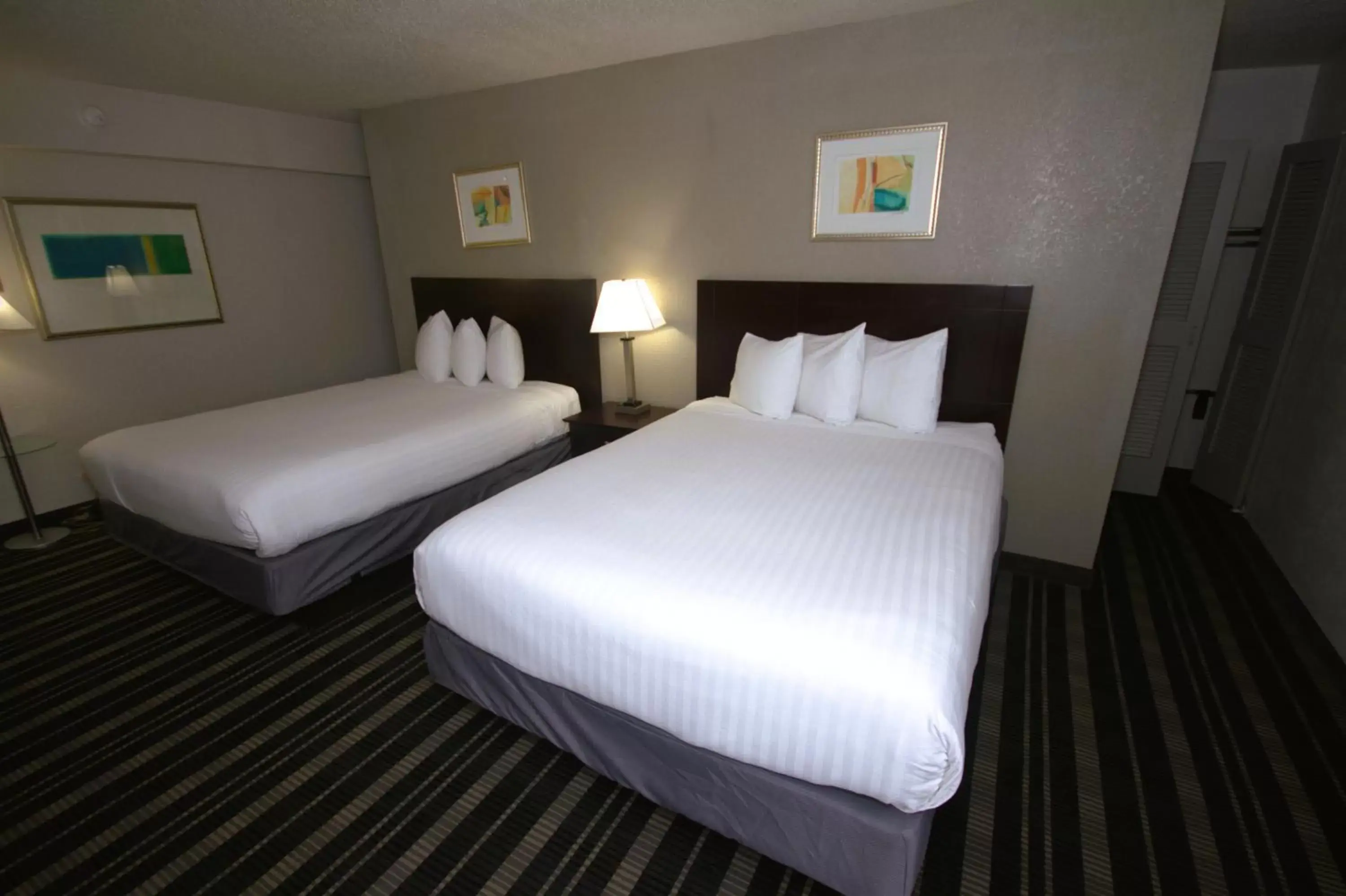 Bedroom, Bed in Atrium Hotel and Suites DFW Airport