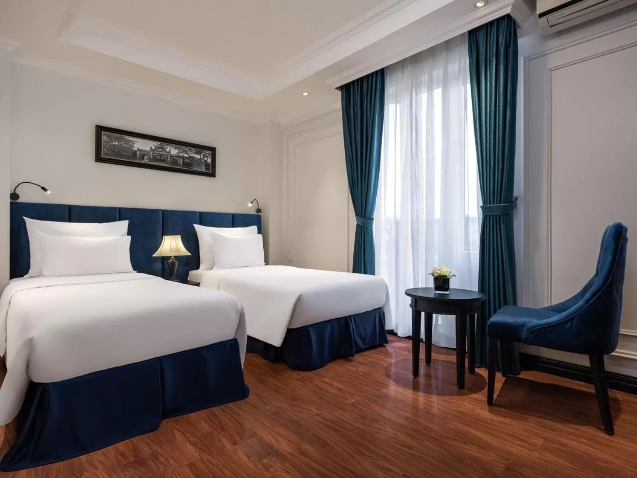 Bed in The Flower Boutique Hotel & Travel