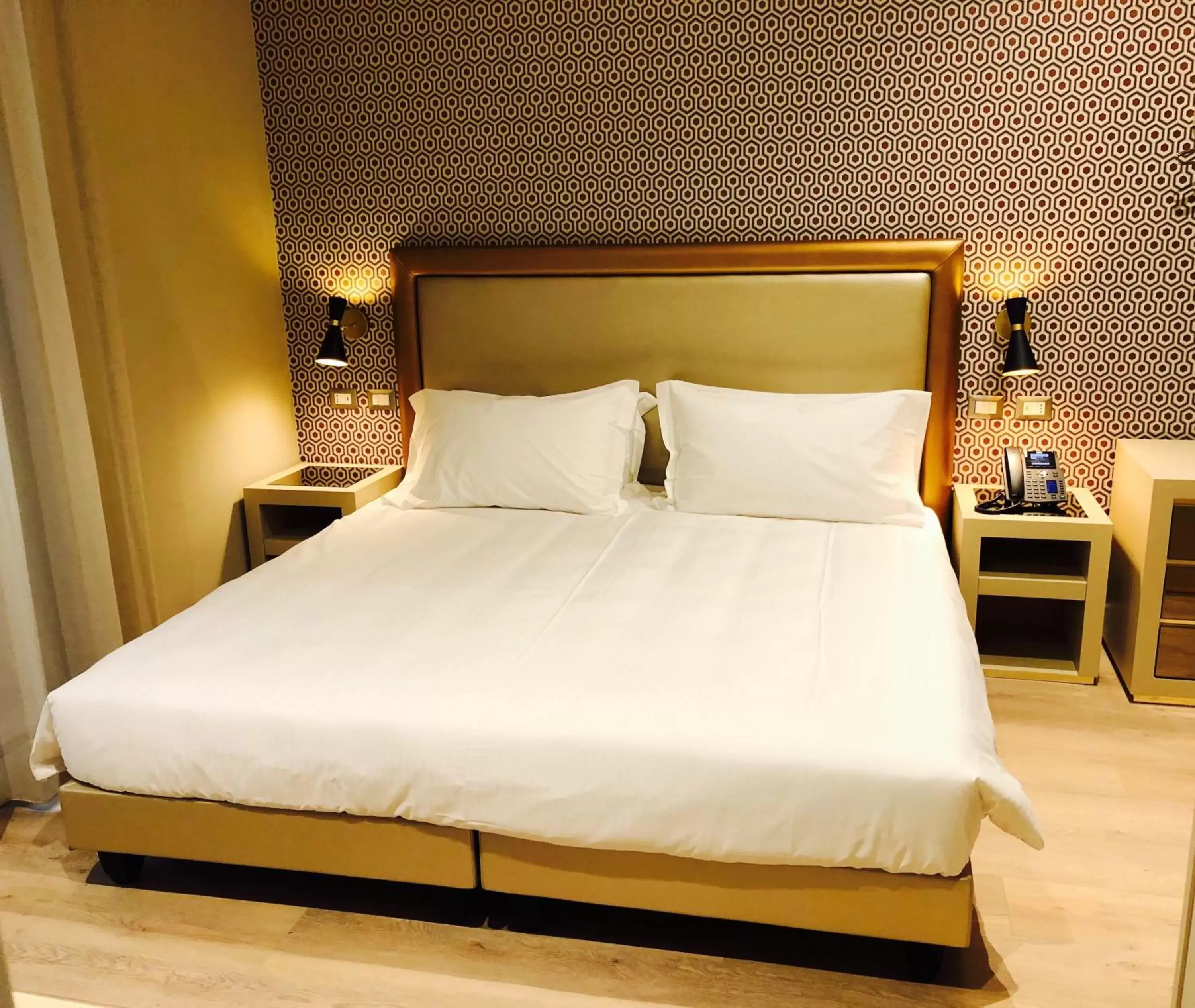 Bed in Caruso Place Boutique & Wellness Suites