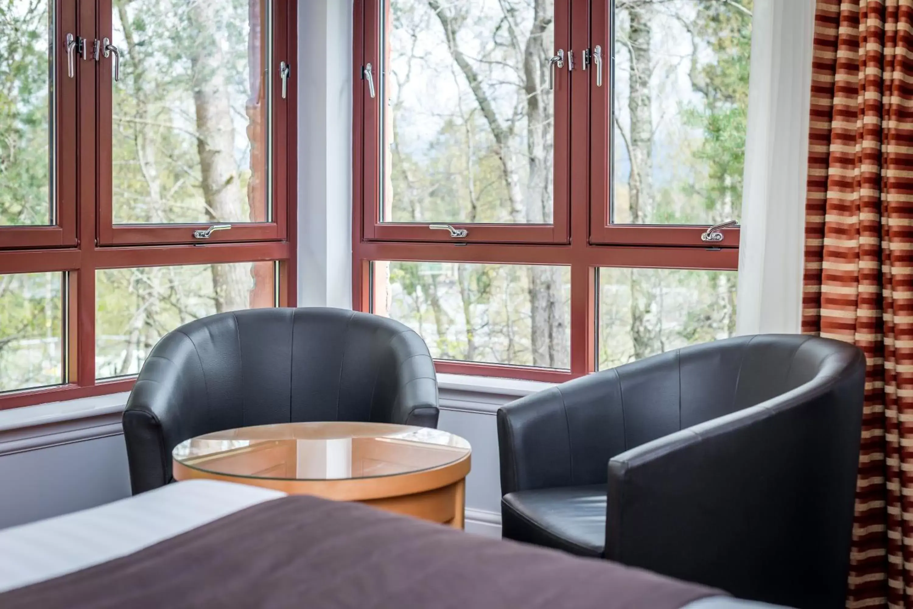 Bedroom, Seating Area in High Range Lodge Hotel