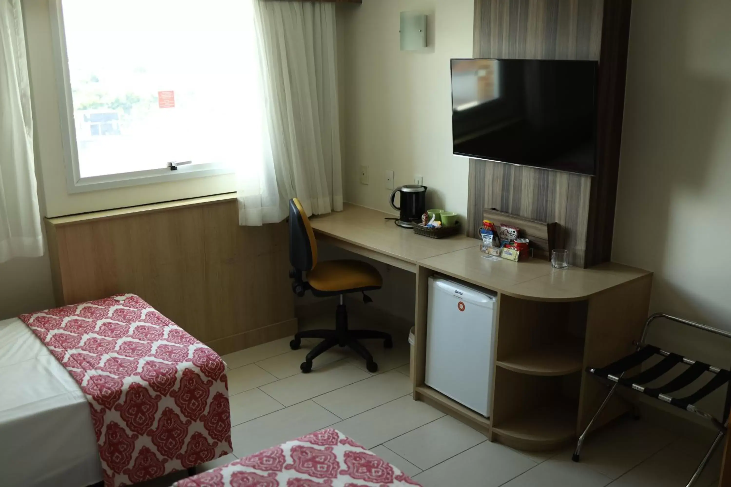 Bed, TV/Entertainment Center in Comfort Hotel Campos dos Goytacazes
