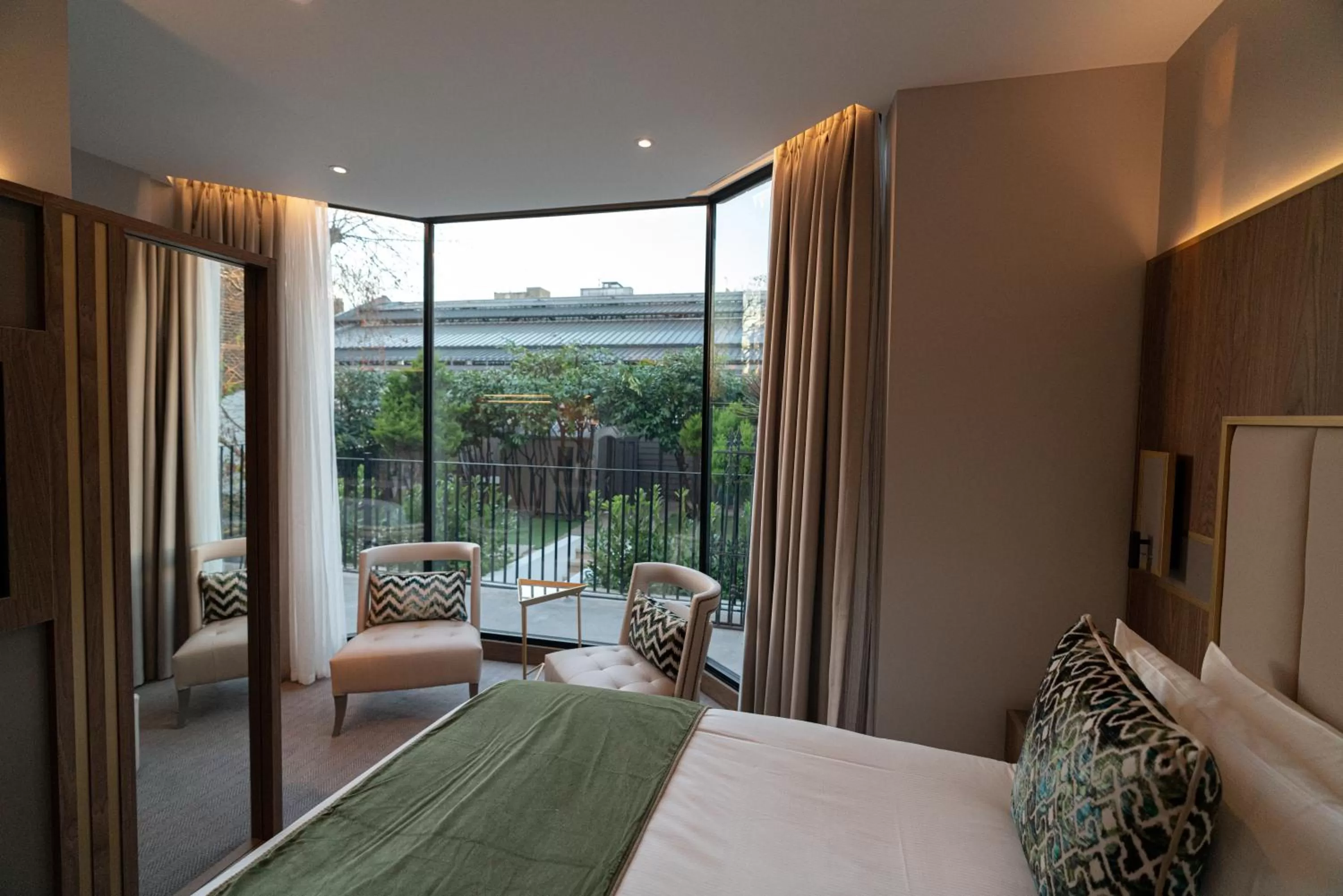 Bed in Merit Kensington Hotel