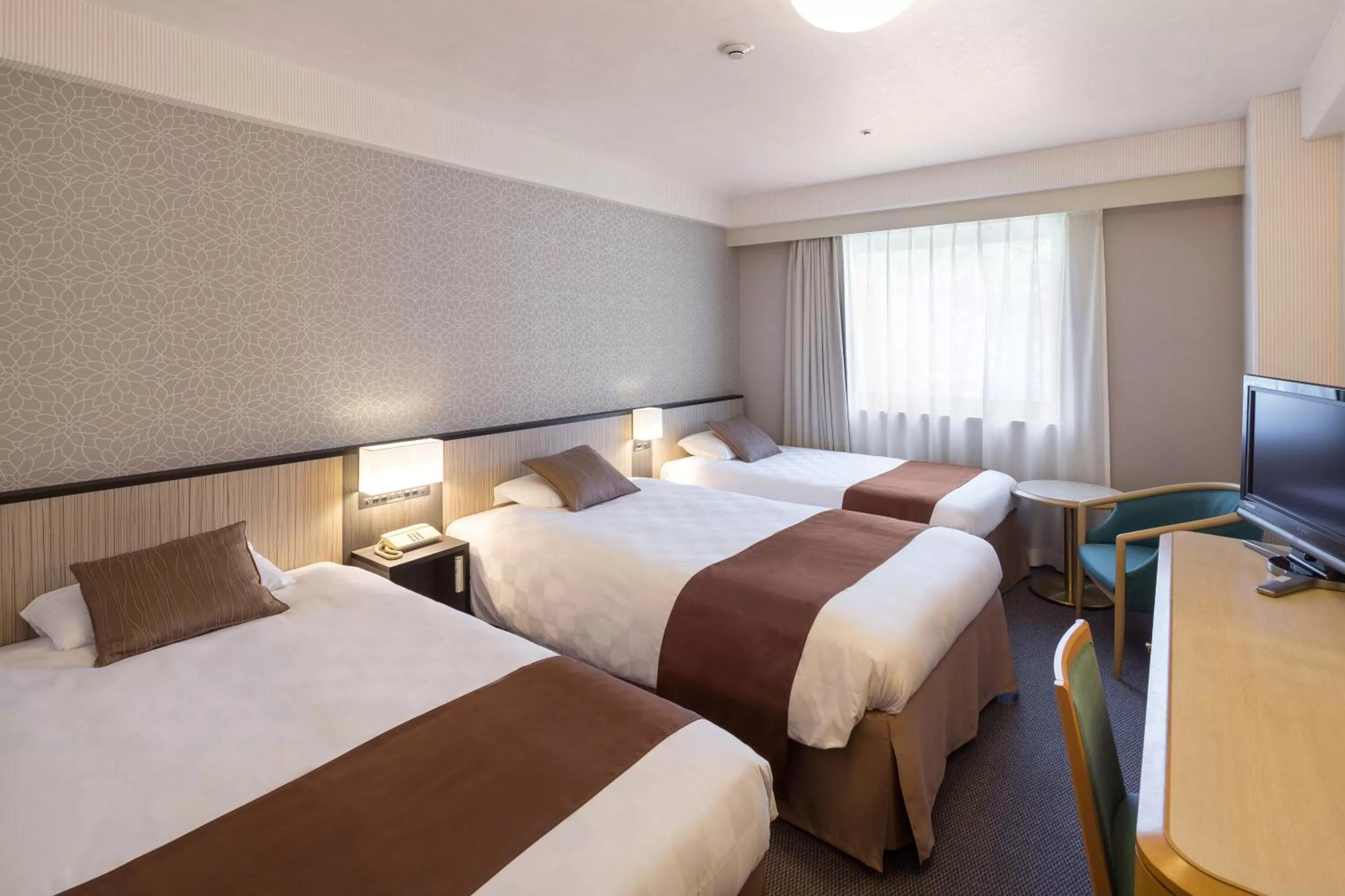 Decorative detail, Bed in Matsuyama Tokyu REI Hotel