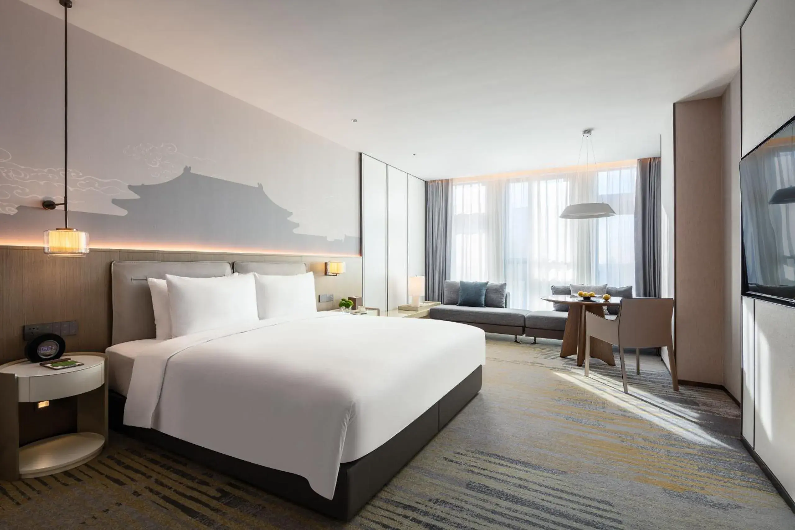 Bed in Grand Metropark Yuantong Hotel