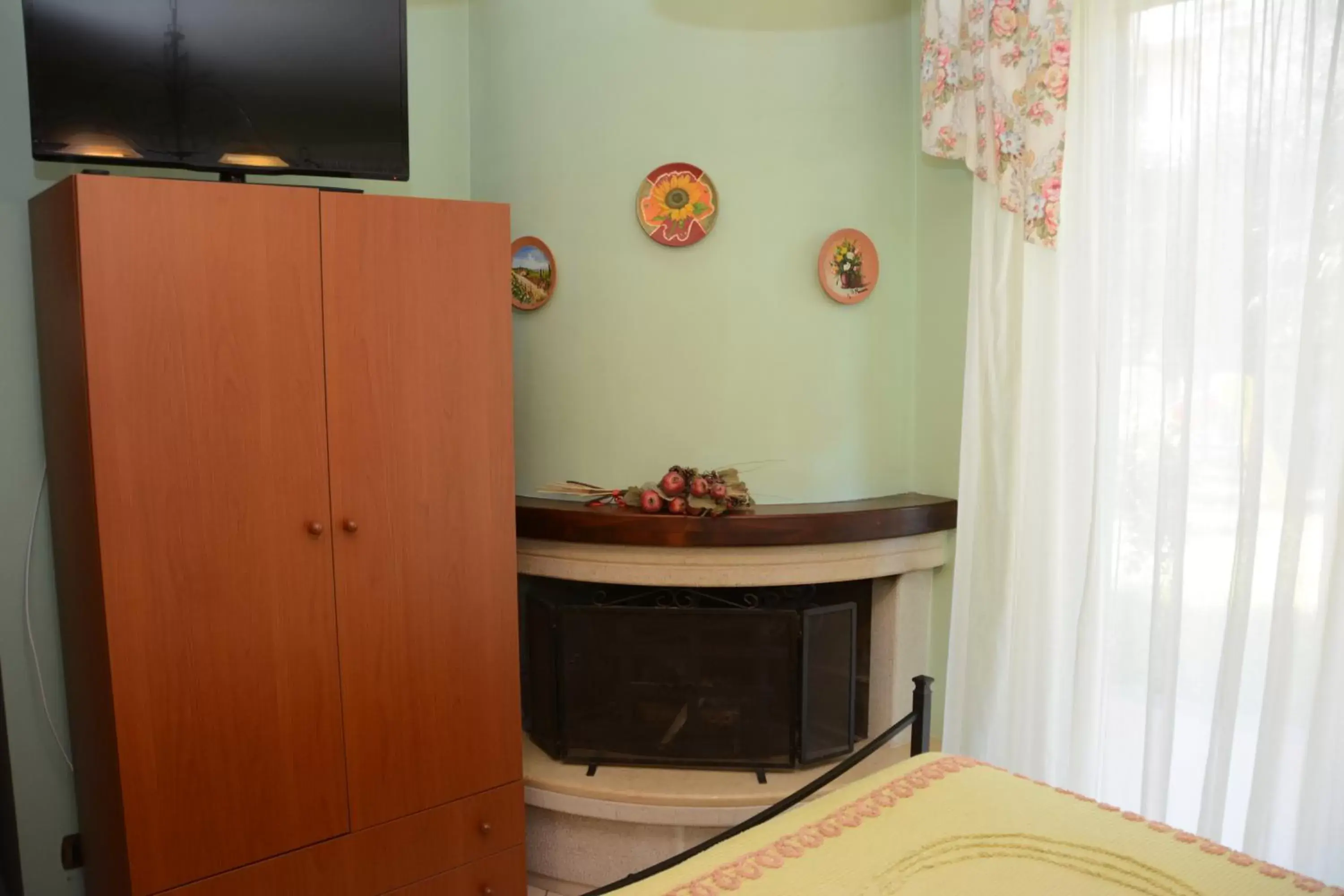 Bed, TV/Entertainment Center in B&B Villa San Leonardo