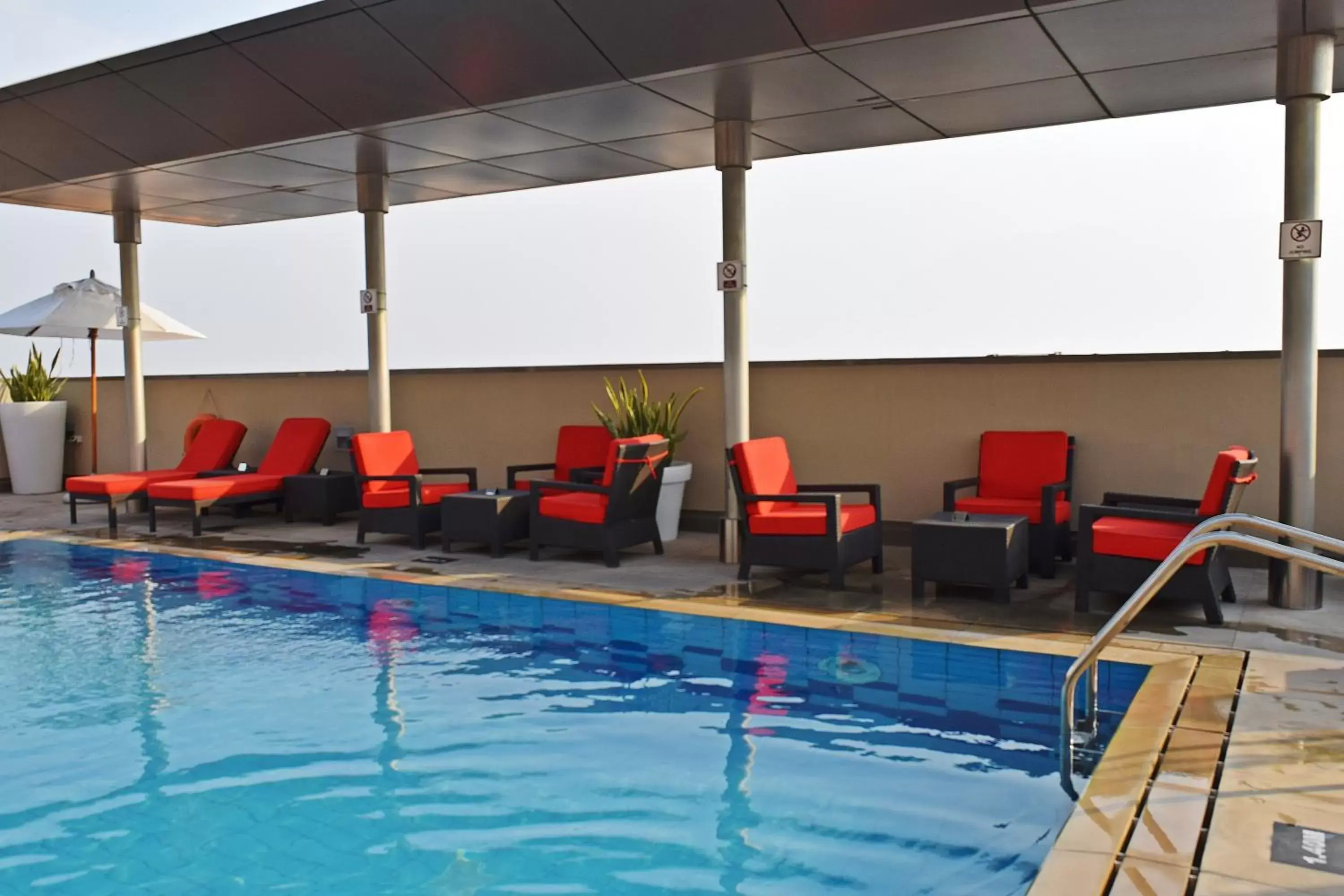 Swimming pool in Centro Al Manhal by Rotana