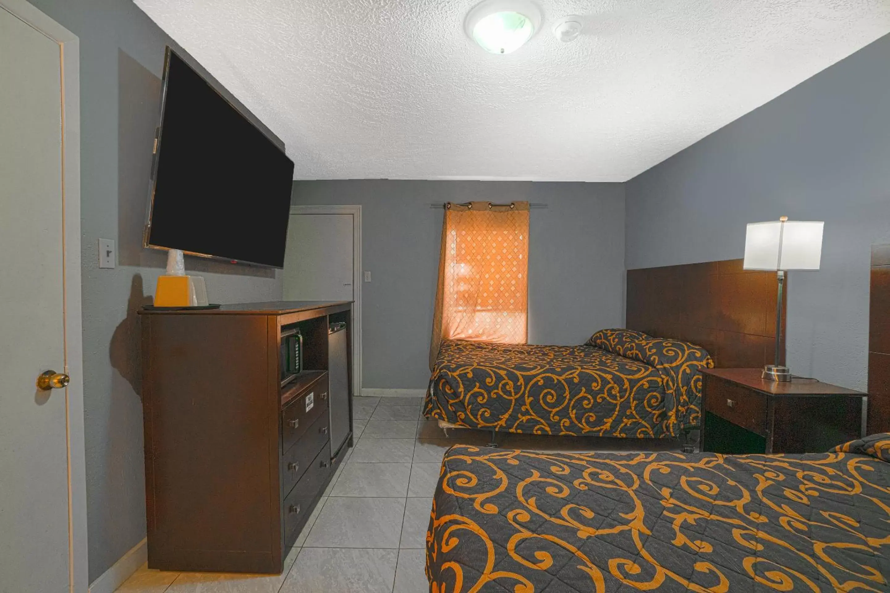 Bedroom, Seating Area in Texana Inn Edna By OYO