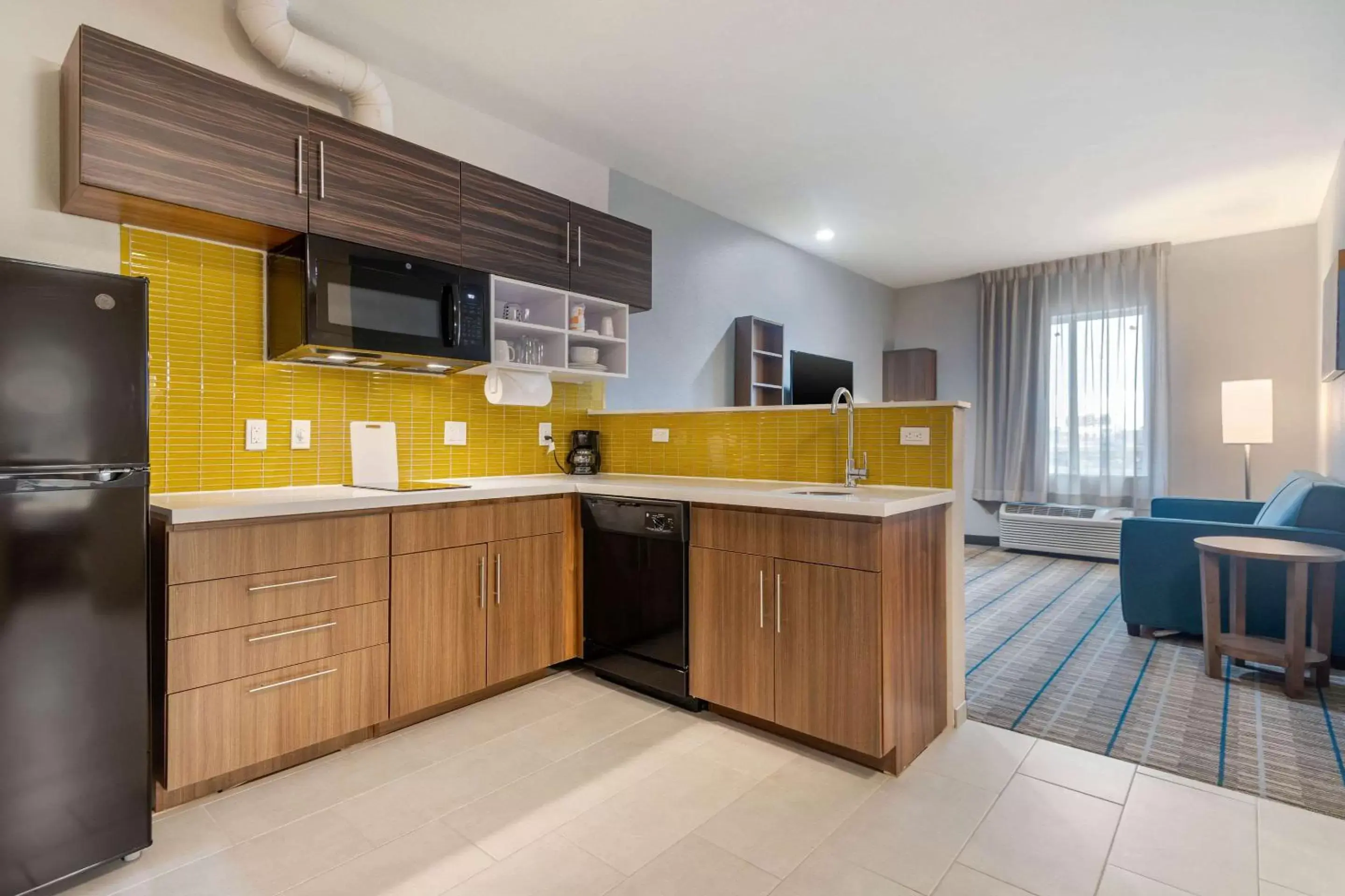 Photo of the whole room, Kitchen/Kitchenette in MainStay Suites Bricktown - near Medical Center