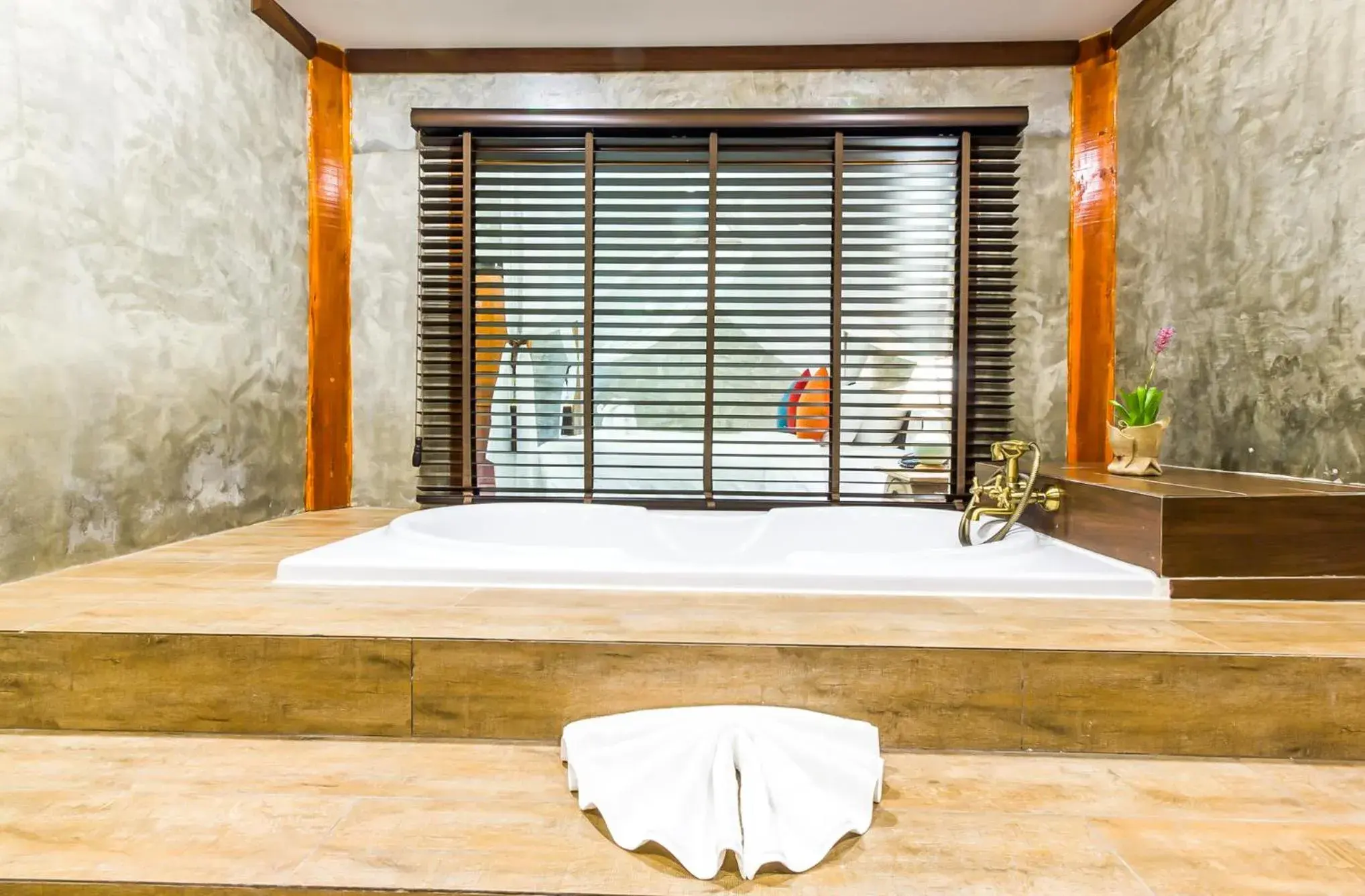 Shower in The Chaya Resort and Spa