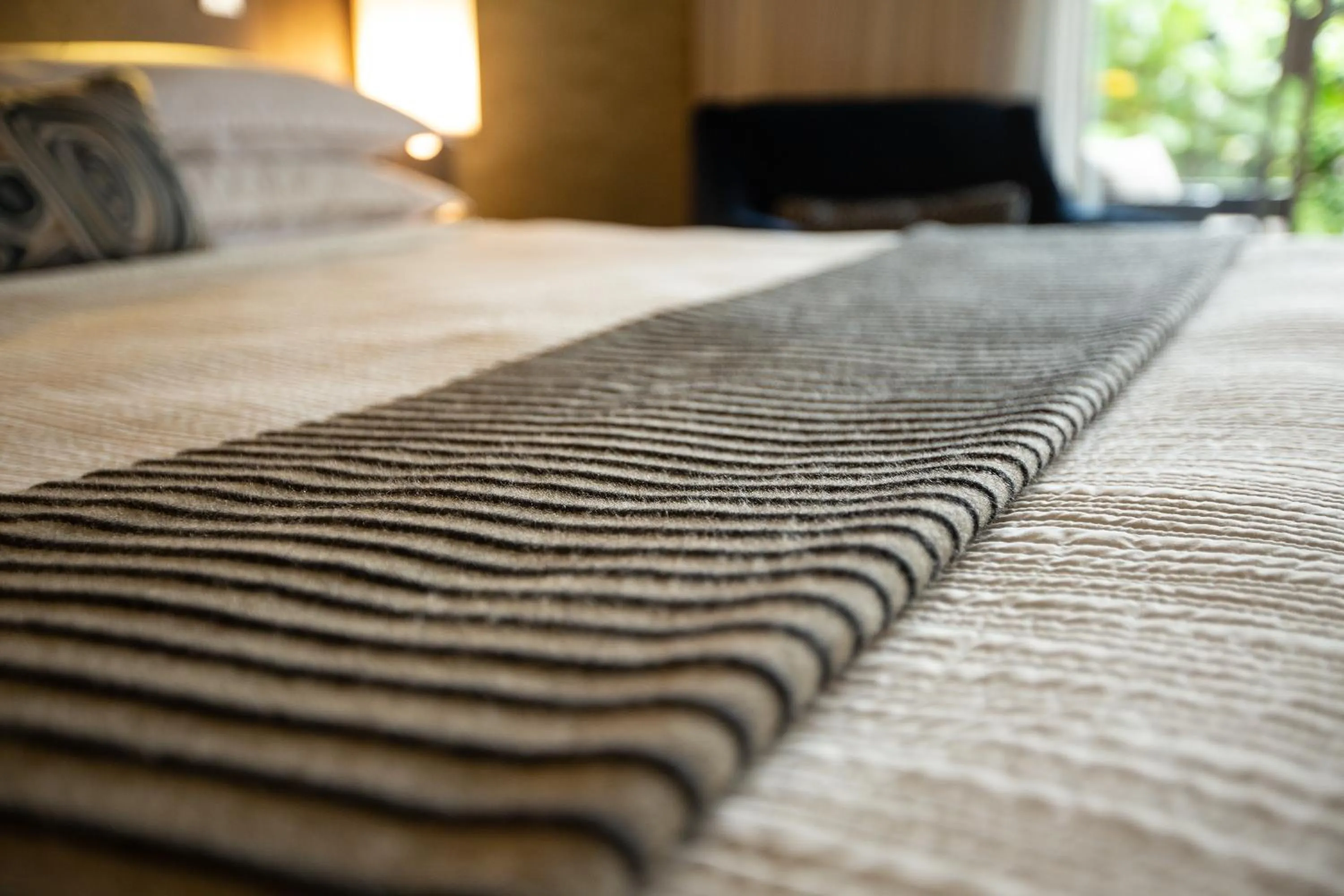 Bed in West Beach Inn, a Coast Hotel