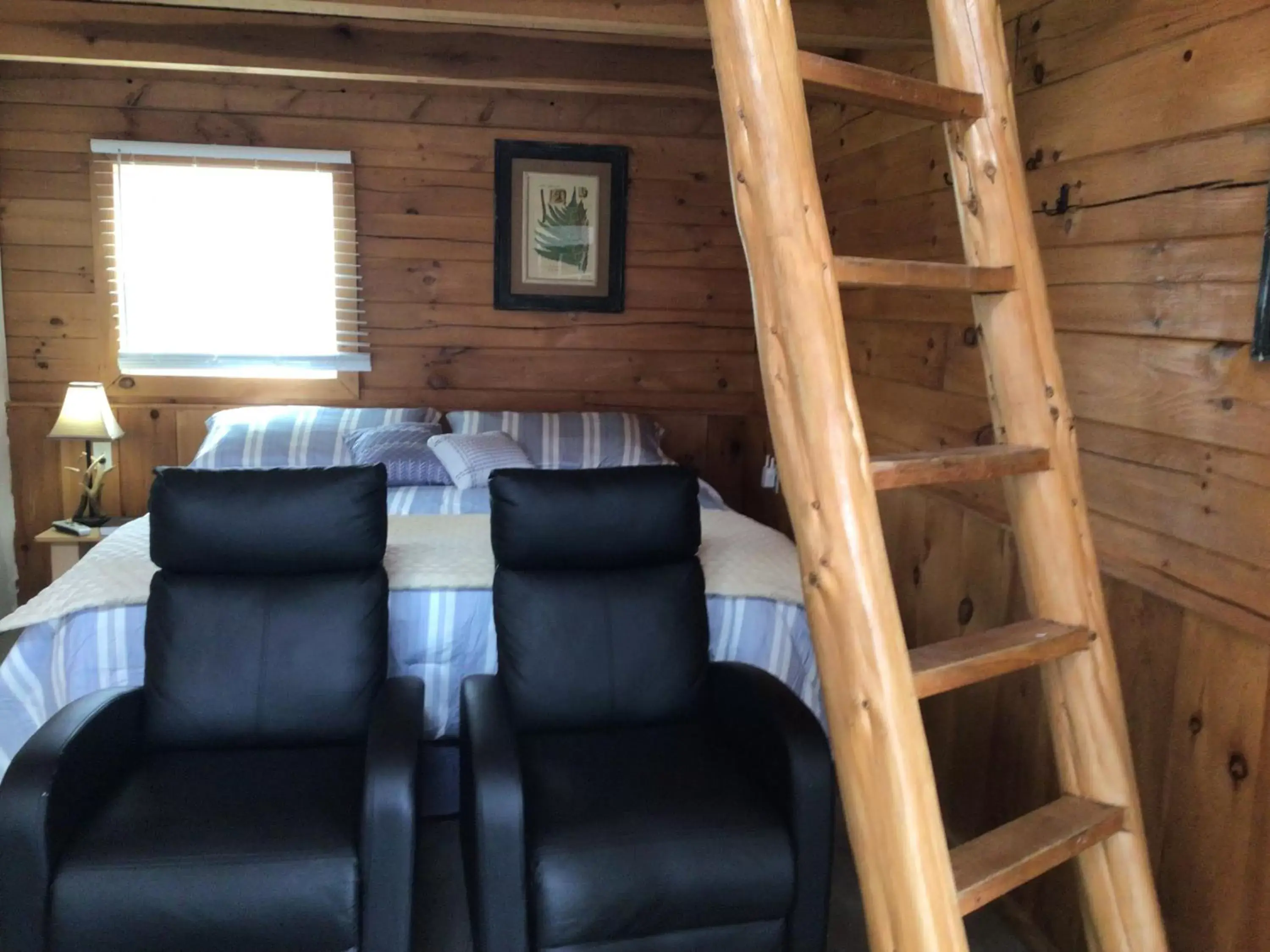 Bed, Seating Area in Kozy Haven Log Cabin Rentals